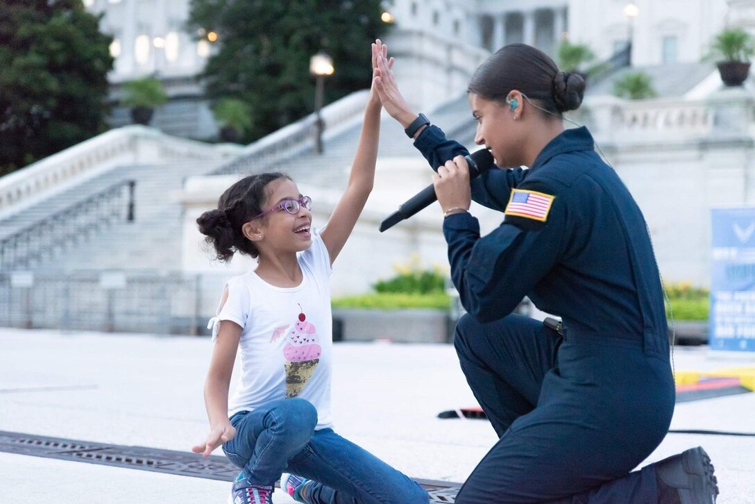 Vocalist inspires young audience member.