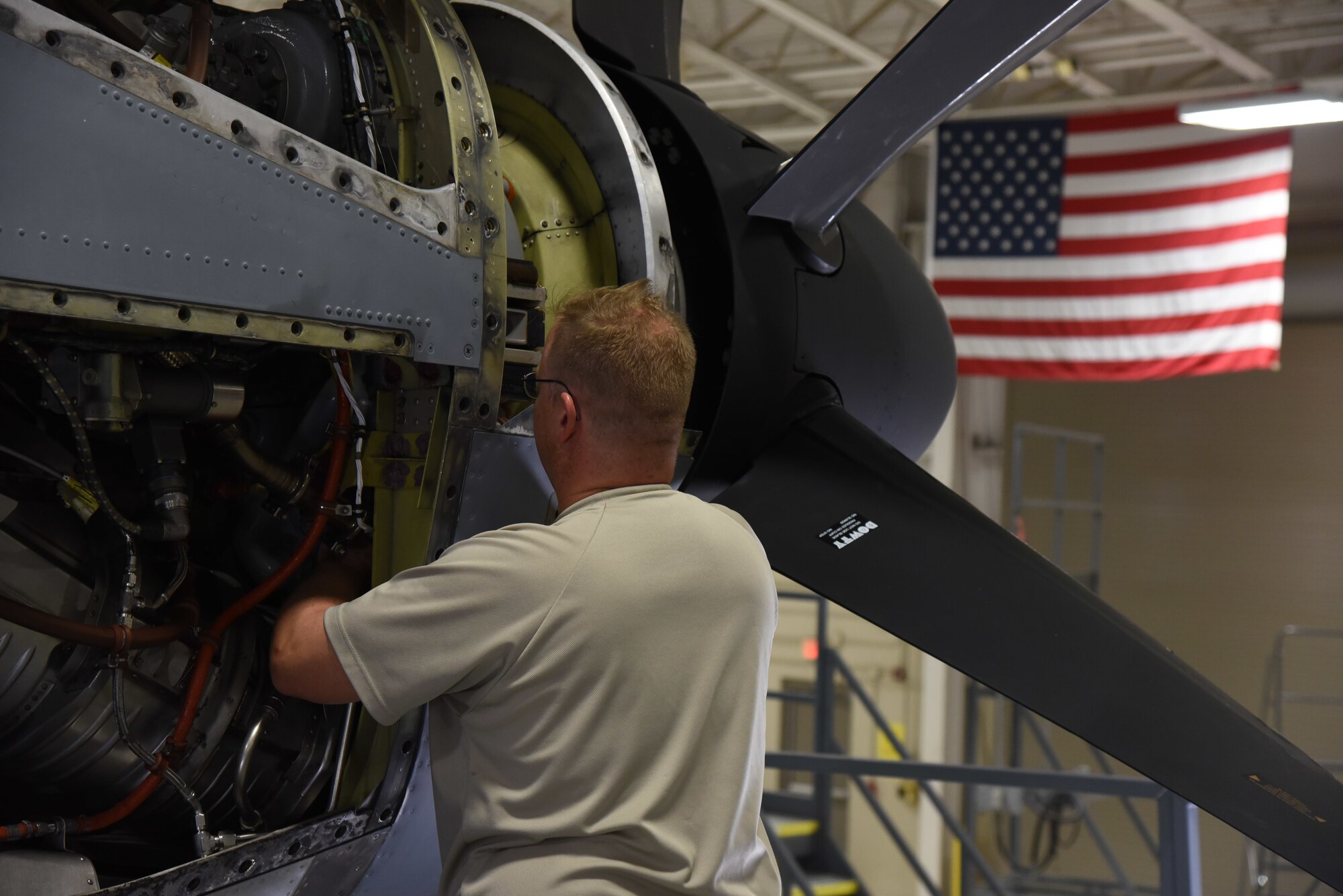 Tech. Sgt. Christopher Botts, 403rd Maintenance Squadron aircraft engine mechanic, works to remove a turbine vibration sensor from a WC-130J engine Jan. 13, 2019. Once removed, Botts will inspect the sensor, thoroughly clean it and reconnect it. (U.S. Air Force photo by Senior Airman Kristen Pittman)