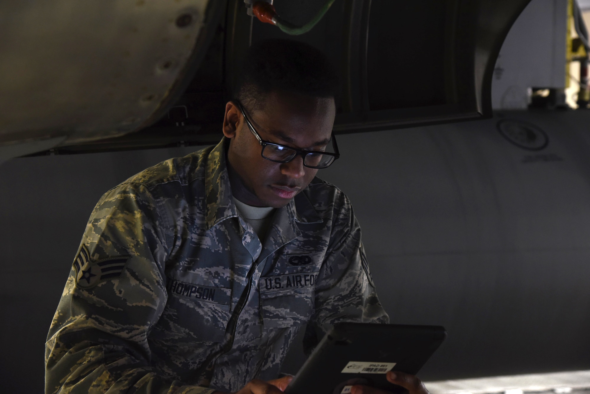 Senior Airman Josh Thompson, 403rd Maintenance Squadron aerospace propulsion mechanic, checks for the next step during the process of removing turbine vibration sensors from an engine on a WC-130J January 13, 2019. The 403rd MXS is responsible for major inspections that take place on their isochronal maintenance docks. (U.S. Air Force photo by Senior Airman Kristen Pittman)