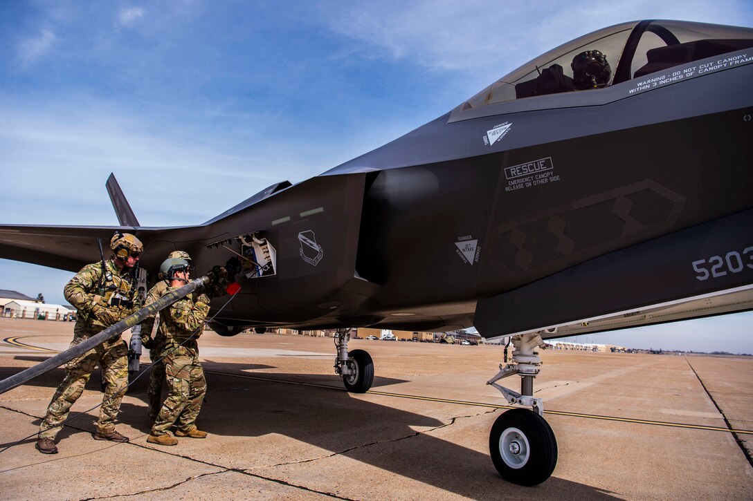 Airmen from the 27th Special Operations Logistics Readiness Squadron connect a fuel hose to a F-35A from the 388th Fighter Wing during Forward Area Refueling Point training at Cannon Air Force Base, N.M., Feb. 27, 2019. This was the first time FARP training was conducted by an MC-130J for the F-35A aircraft as it expands its reach and capabilties. (U.S. Air Force photo by Staff Sgt. Luke Kitterman)