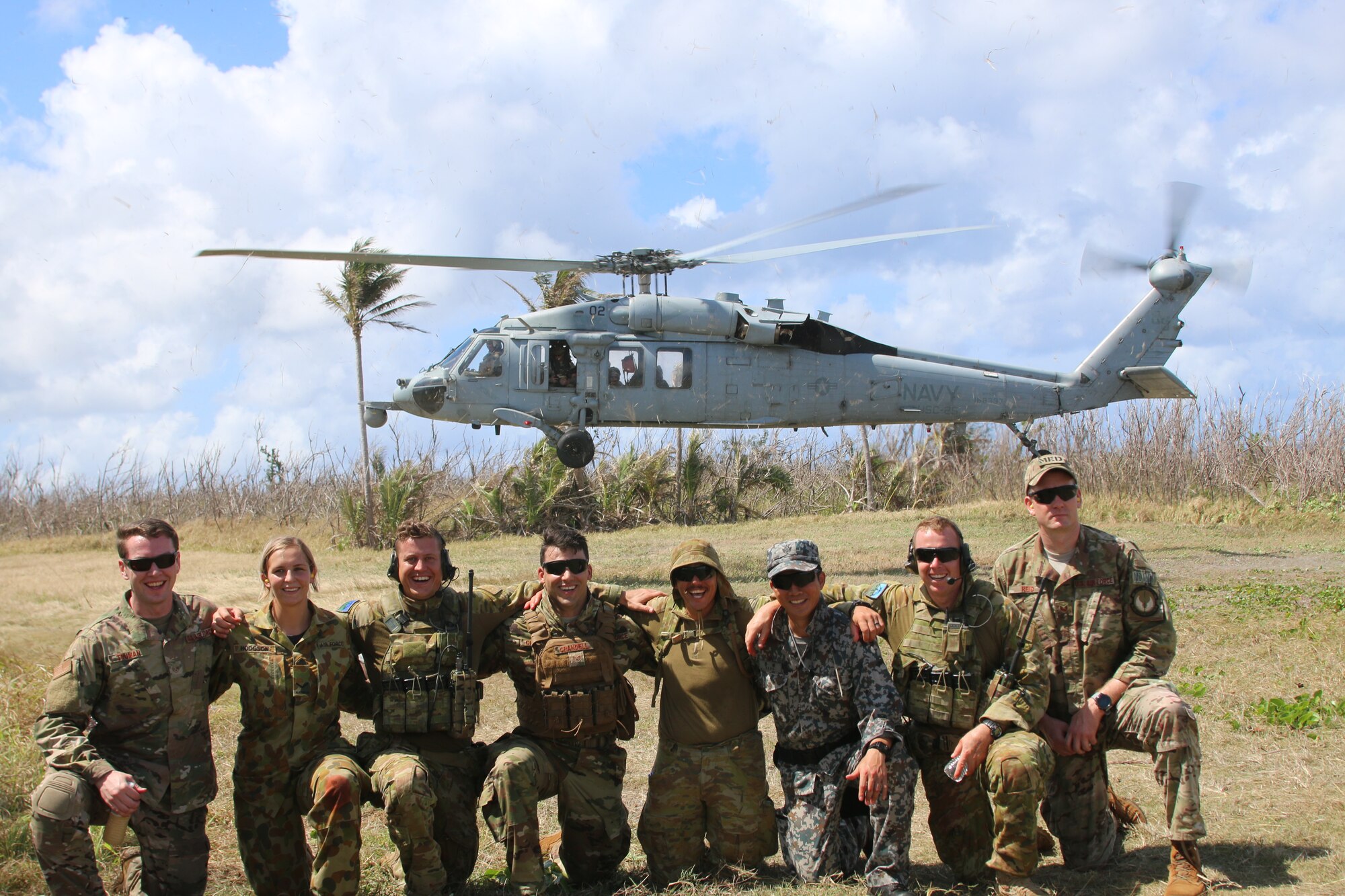 Service members from the United States, Royal Australian Air Force, and the Japan Air Self-Defense Force pose for a photo after an aeromedical evacuation exercise during Cope North 2019 Feb. 27, 2019, at Tinian, Commonwealth of the Northern Marianas. Service members from the U.S., Royal Australian Air Force, and the Japan Air Self-Defense Force exercised their Humanitarian Assistance and Disaster Relief skills together on Tinian by providing emergency medical care and secure transportation for simulated patients. (Courtesy photo)