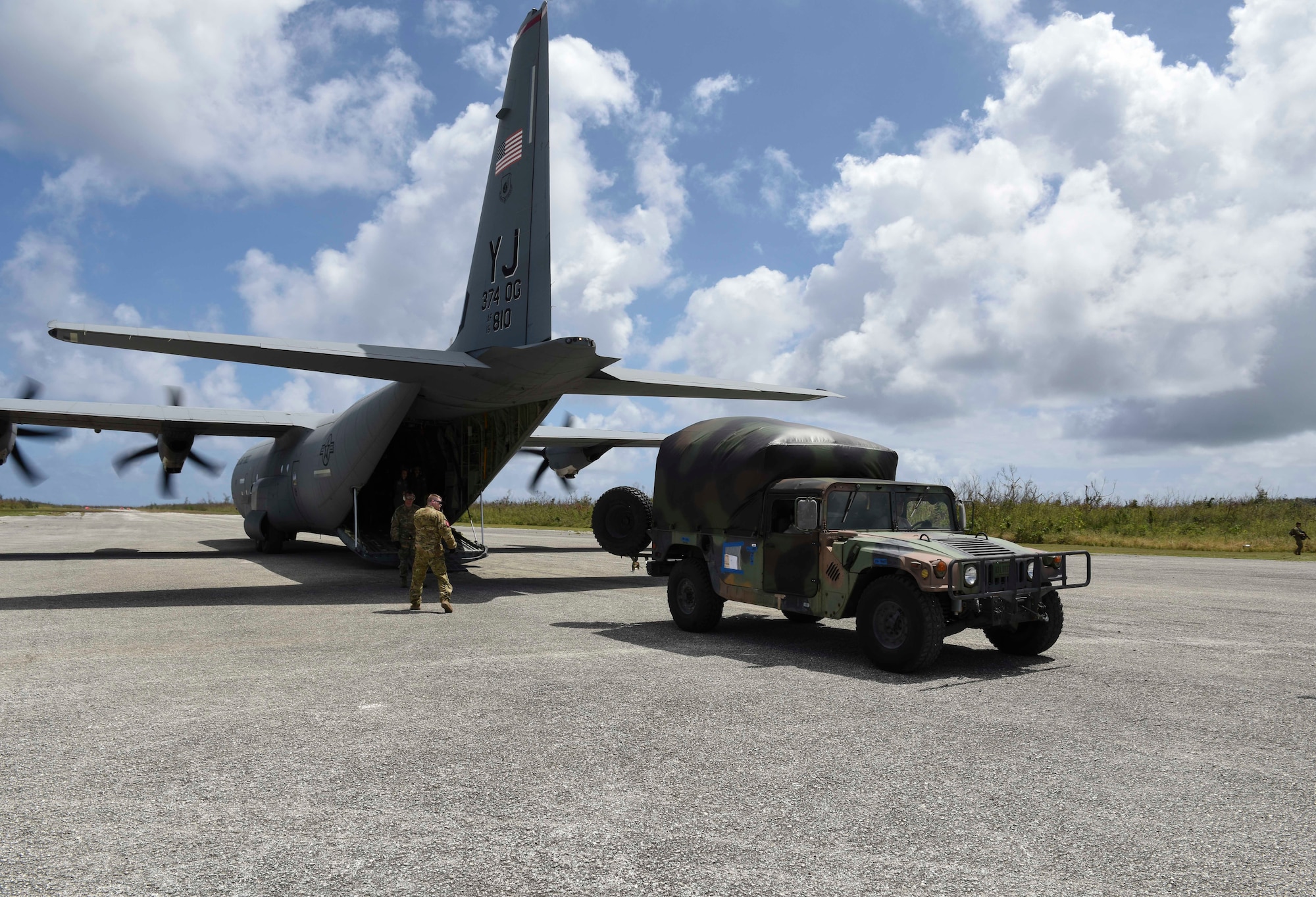 United States service members transfer personnel with simulated injuries onto a C-130J from Yokota Air Base, Japan, during an exercise for Cope North 2019, Feb. 27, 2019, at Tinian, Commonwealth of the Northern Marianas. On Feb. 27, service members from the U.S., Royal Australian Air Force, and the Japan Air Self-Defense Force exercised their Humanitarian Assistance and Disaster Relief skills together on Tinian by providing emergency medical care and secure transportation for simulated patients. (U.S. Air Force photo by Tech. Sgt. Jake Barreiro)
