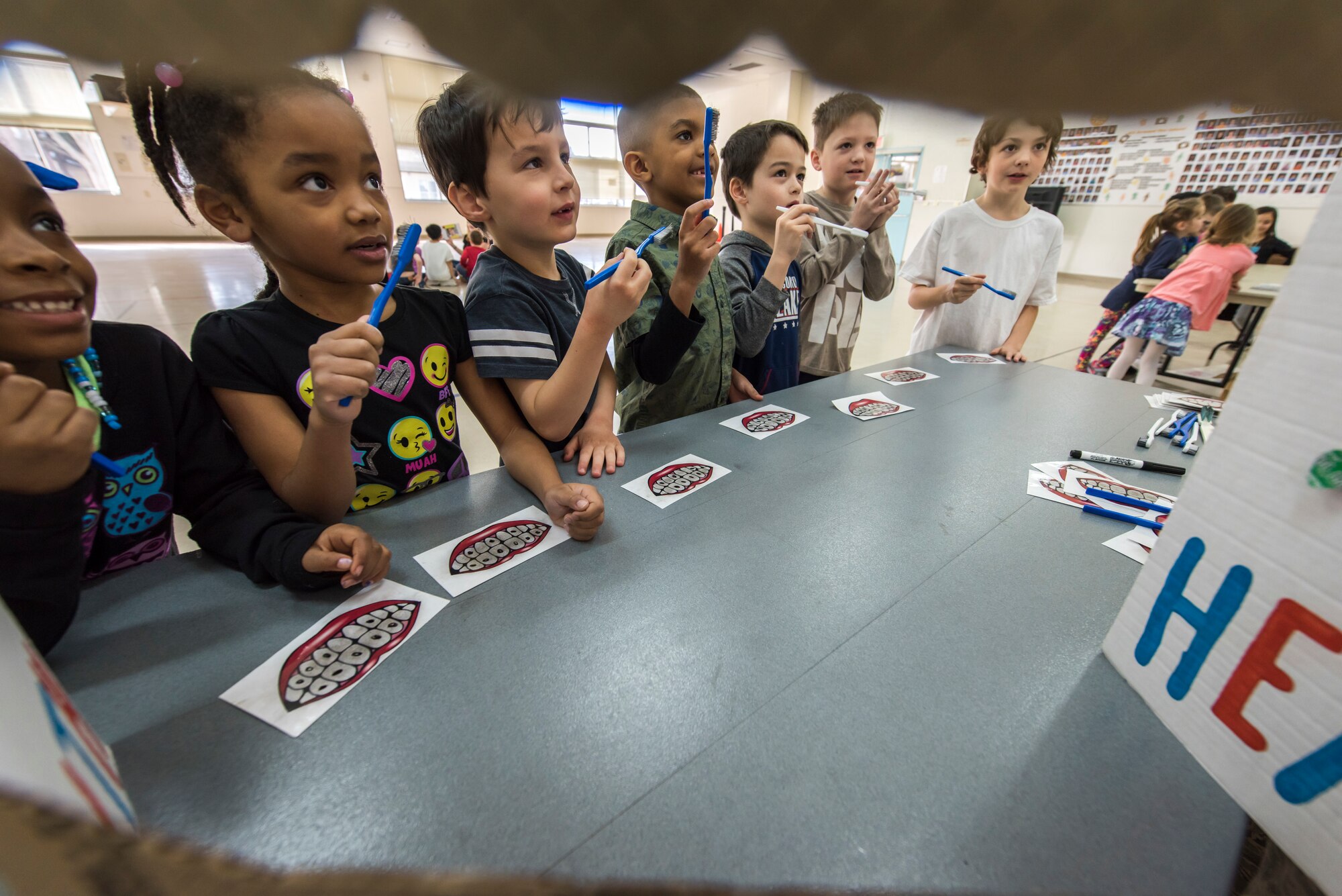 Sollars Elementary School students practice proper brushing techniques during the National Dental Health Month workshop at Misawa Air Base, Japan, Feb. 26, 2019. Dental professionals hosted a variety of workshops regarding healthy eating habits, flossing techniques and teeth brushing. (U.S. Air Force photo by Airman 1st Class Collette Brooks)