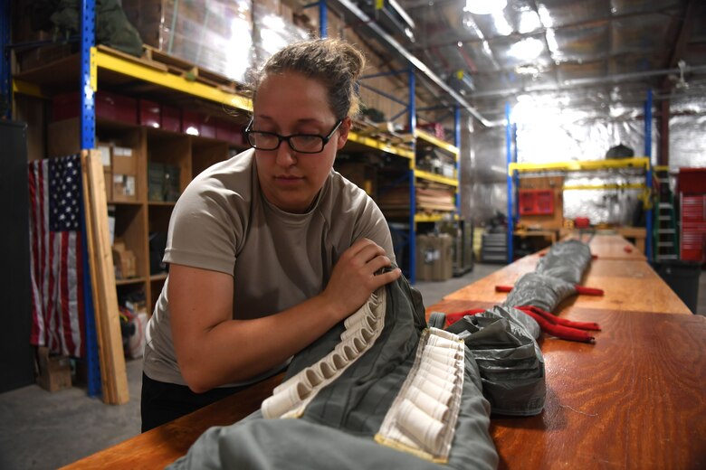 The 82nd Expeditionary Rescue Squadron aircrew flight equipment flight maintains parachutes for operations in East Africa. (Last names withheld for security purposes.)