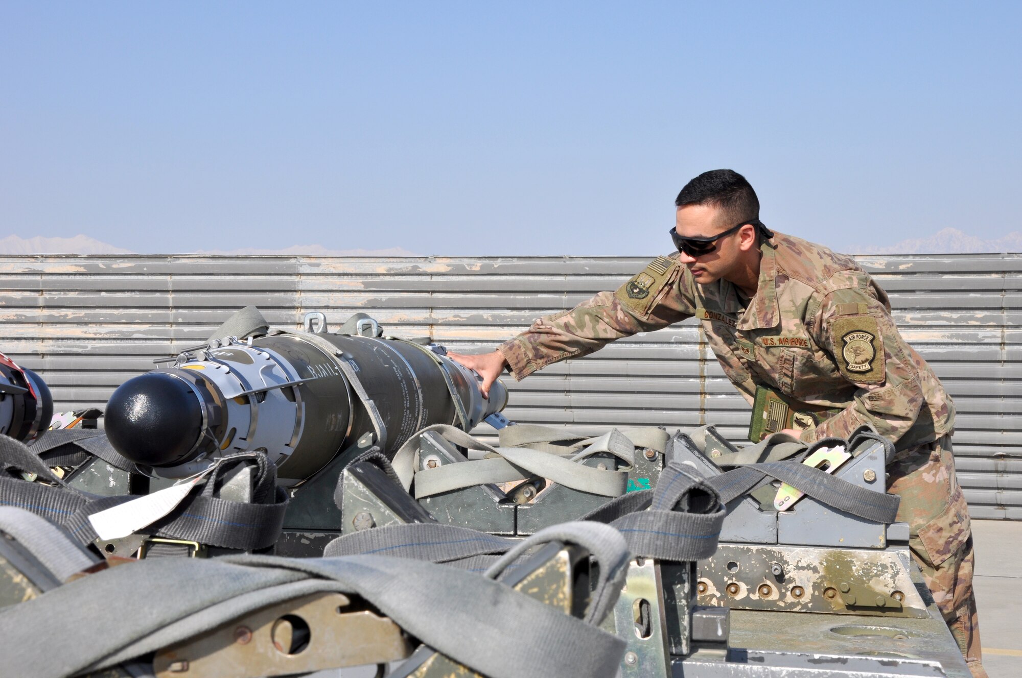 Staff Sgt. Tomas Gonzalez, 455th Air Expeditionary Wing weapons safety manager, inspects a GBU-54 laser joint directed attack munition at Bagram Airfield, Afghanistan, Feb. 22, 2019.