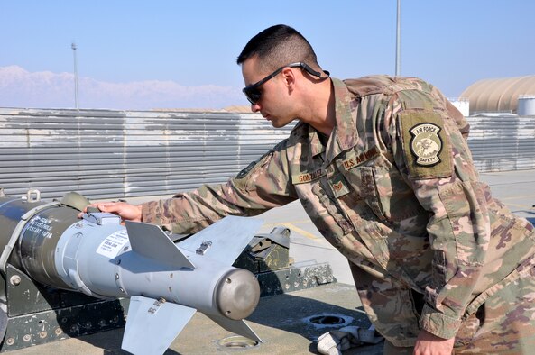 Staff Sgt. Tomas Gonzalez, 455th Air Expeditionary Wing weapons safety manager, inspects a GBU-54 laser joint directed attack munition at Bagram Airfield, Afghanistan, Feb. 22, 2019.