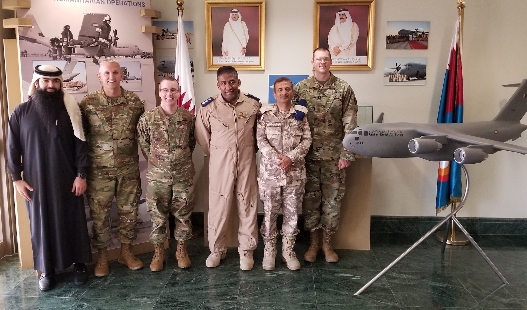 Members of the Qatar Emiri Air Force (QEAF) and the West Virginia National Guard pose for a photo Feb. 14, 2019, while touring the QEAF facilities at Al Udeid Air Base, Qatar. During a five-day tour, three members of the West Virginia Air National Guard’s 130th and 167th Airlift Wings, as well as the State Partnership Program Coordinator for Qatar,  were provided insight into the operations of Qatar’s air force and met with key QEAF leaders for discussion on interoperability of forces and future engagement opportunities. (Courtesy photo)