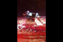 A vehicle rests in a snowbank after a rollover Feb. 20, 2019, near Malmstrom Air Force Base, Mont.