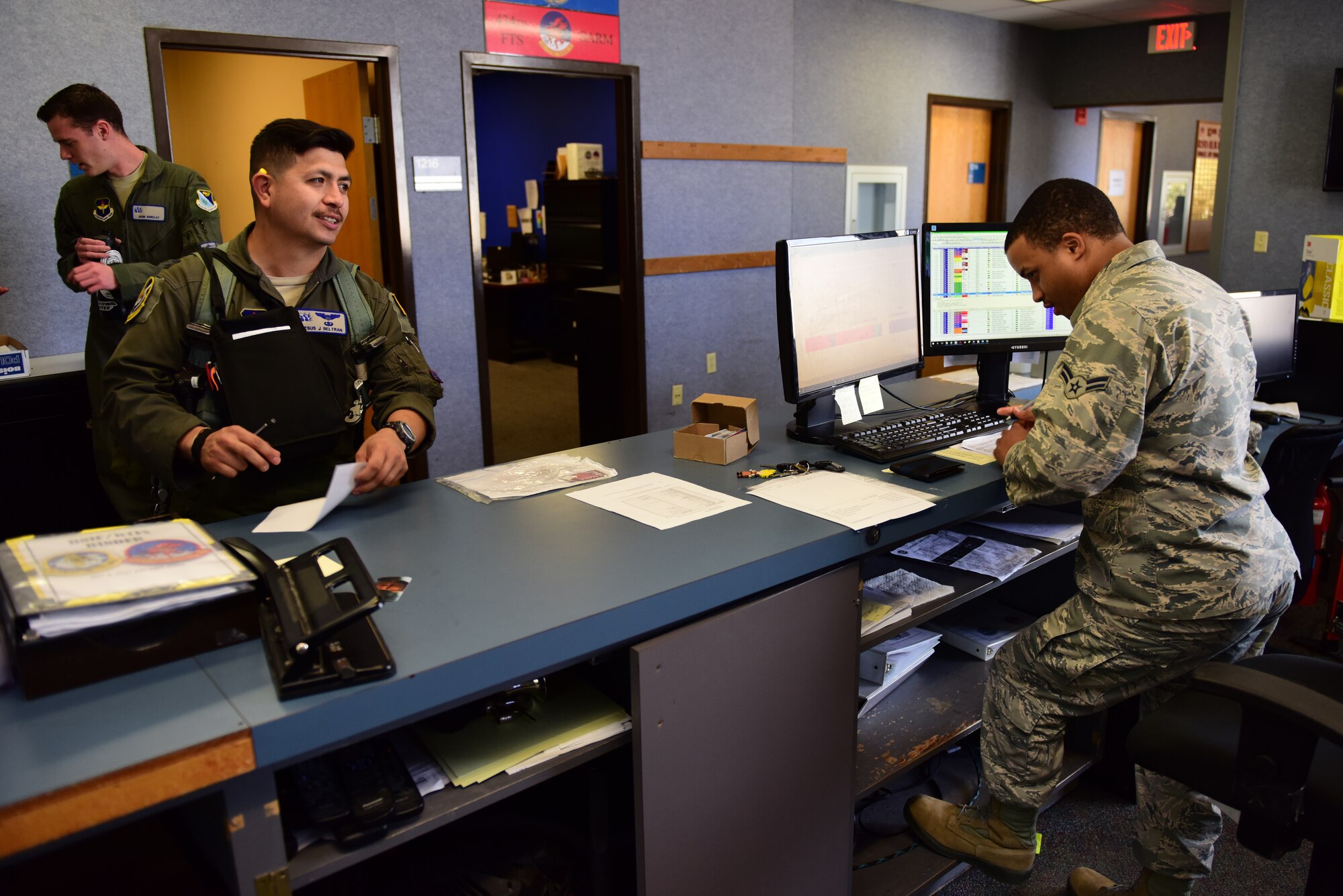 Airman 1st Class Kye Moffett, 434th Flying Training Squadron aviation resource manager, sends an instructor pilot on his way at Laughlin Air Force Base, Texas, Feb. 27, 2019. Moffett, a member of Laughlin’s “1Charlies,” or aviation resource managers, played a hand in the unit winning the 2018 Sgt. Dee Campbell Outstanding Small Unit Award, one of their many decorations. (U.S. Air Force photo by Senior Airman Benjamin N. Valmoja)
