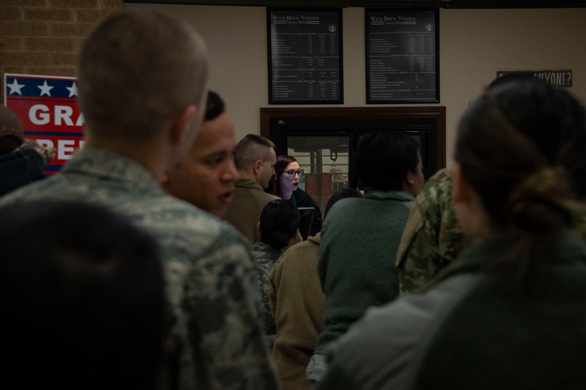 Airmen from the 97th Air Mobility Wing line up to order beverages from the new Wild Brew Yonder coffee shop, Feb. 29, 2019 at Altus Air Force Base, Okla.