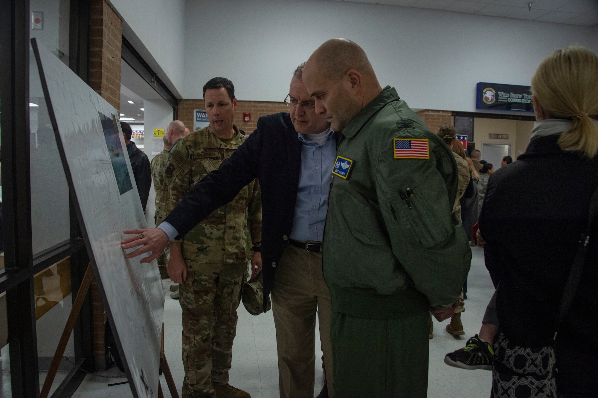Don Walter Jr., Exchange general manager for Fort Sill, Okla./Sheppard Air Force Base/Altus AFB, shows U.S. Air Force Col. Eric Carney, 97th Air Mobility Wing commander and Col. Robert Pedersen, 97th Mission Support Group commander the expansion plans for the Base Exchange, Feb. 29, 2019 at Altus Air Force Base, Okla.