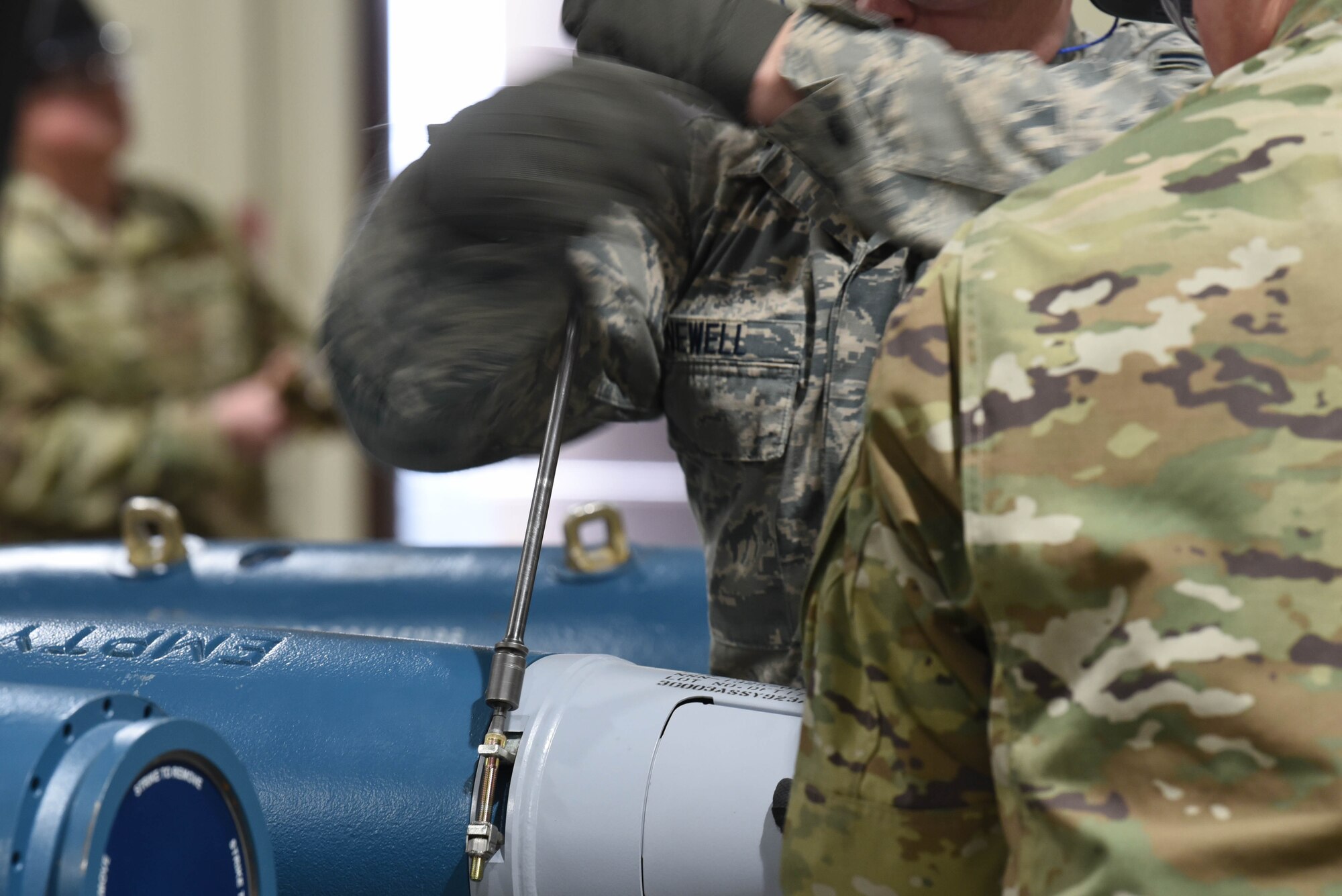 Airman 1st Class William Newell, a 28th Munitions Squadron conventional maintenance technician, attaches a tail assembly to a small-diameter bomb during the qualifying round of the second annual Air Force Combat Operations Competition on Ellsworth Air Force Base, S.D., Feb. 5, 2019. The competition is Air Force-wide and is used to determine the best of the best in munitions operations. (U.S. Air Force photo by Airman John Ennis)