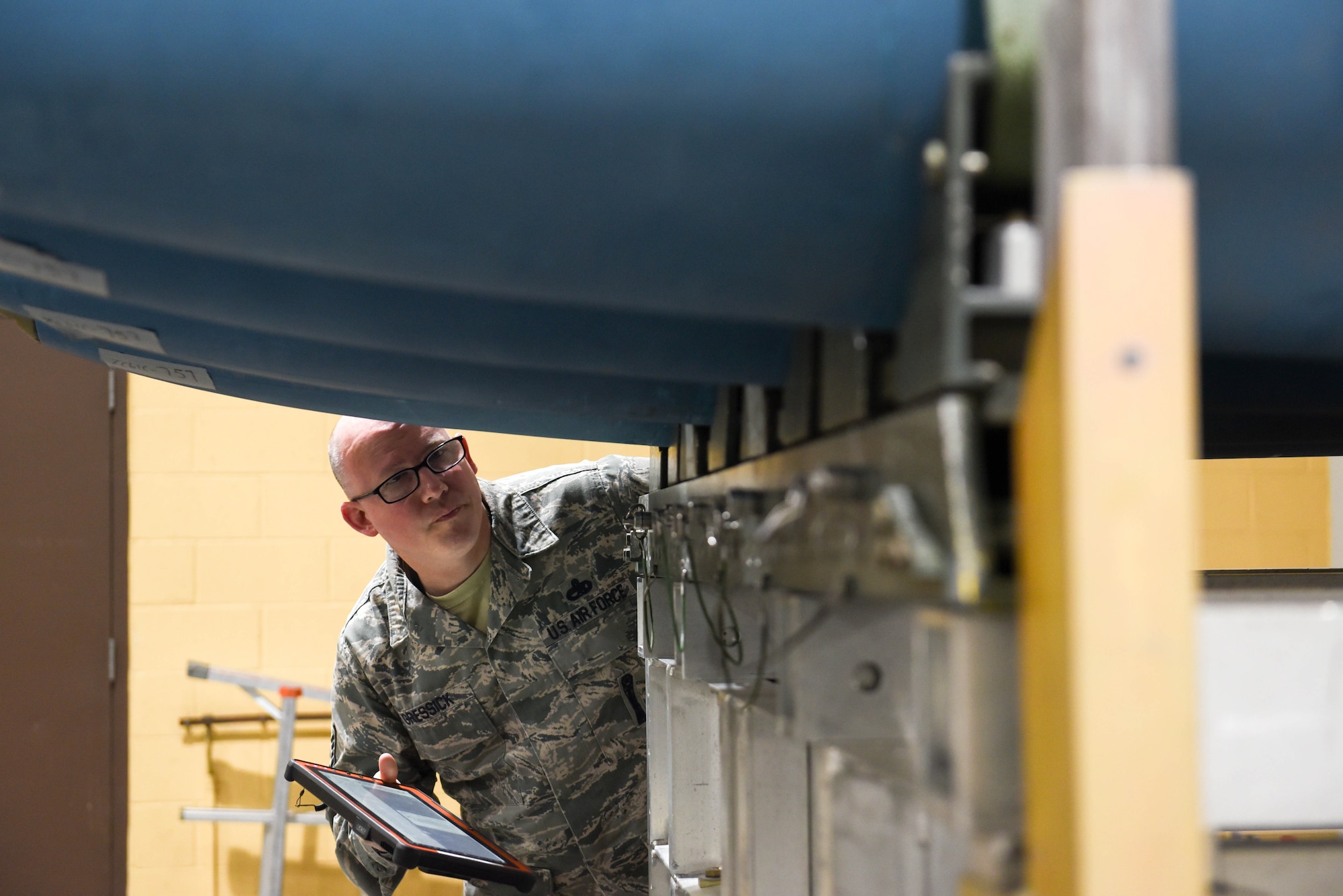 Master Sgt. James Gressick, a U.S. Air Force Global Strike Command Conventional Munitions Division command munitions manager, inspects the completed bombs during the qualifying round of the second annual Air Force Combat Operations Competition on Ellsworth Air Force Base, S.D., Feb. 5, 2019. The competition is Air Force-wide and is used to determine the best of the best in munitions operations. (U.S. Air Force photo by Amn John Ennis)