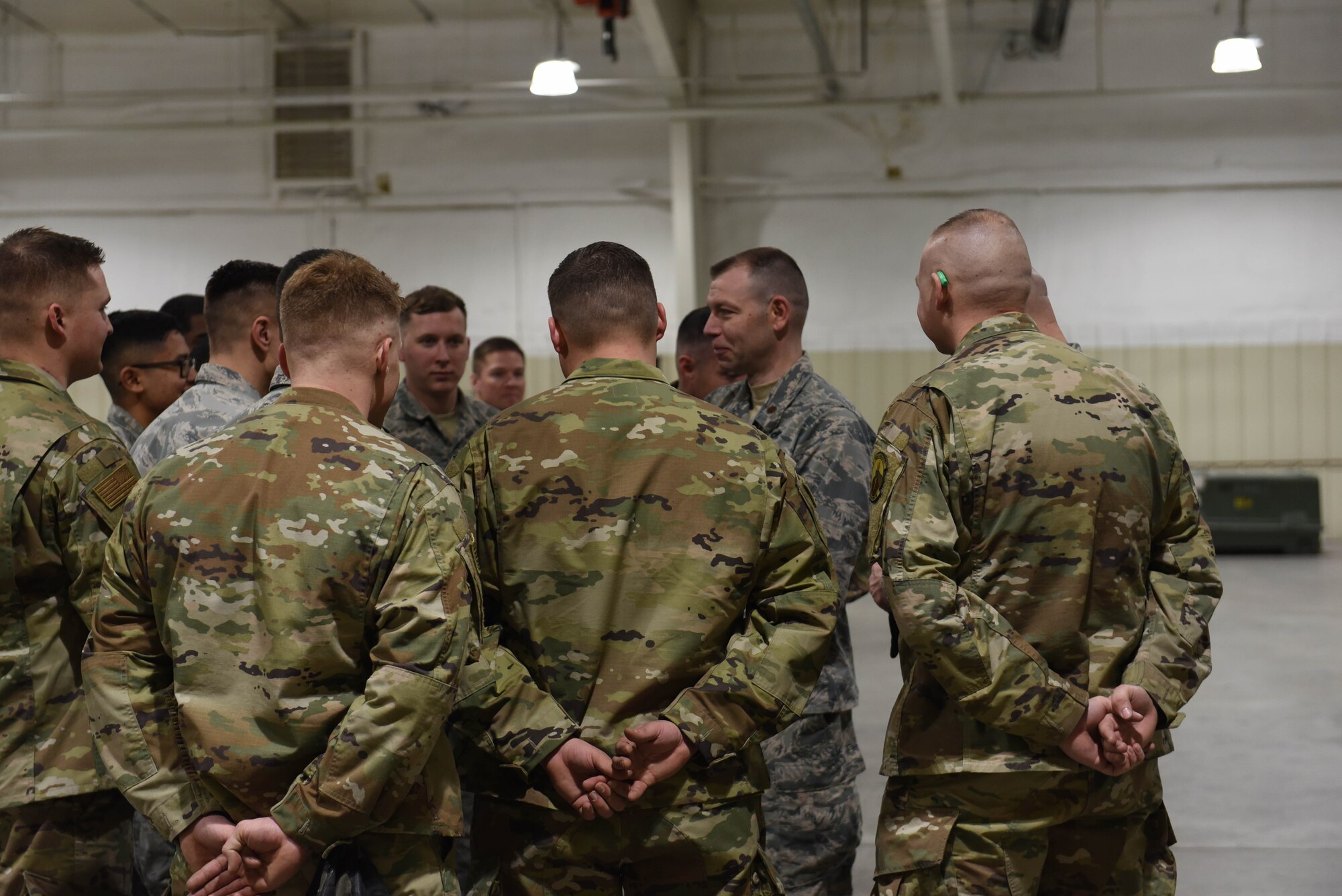 The commander of the 28th Munitions Squadron, Maj. Adam Pierce, addresses the team after they completed the qualifying round of the second Air Force Combat Operations Competition on Ellsworth Air Force Base, S.D., Feb. 5, 2019. The competition is Air Force-wide and is used to determine the best of the best in munitions operations. (U.S. Air Force photo by Airman John Ennis)