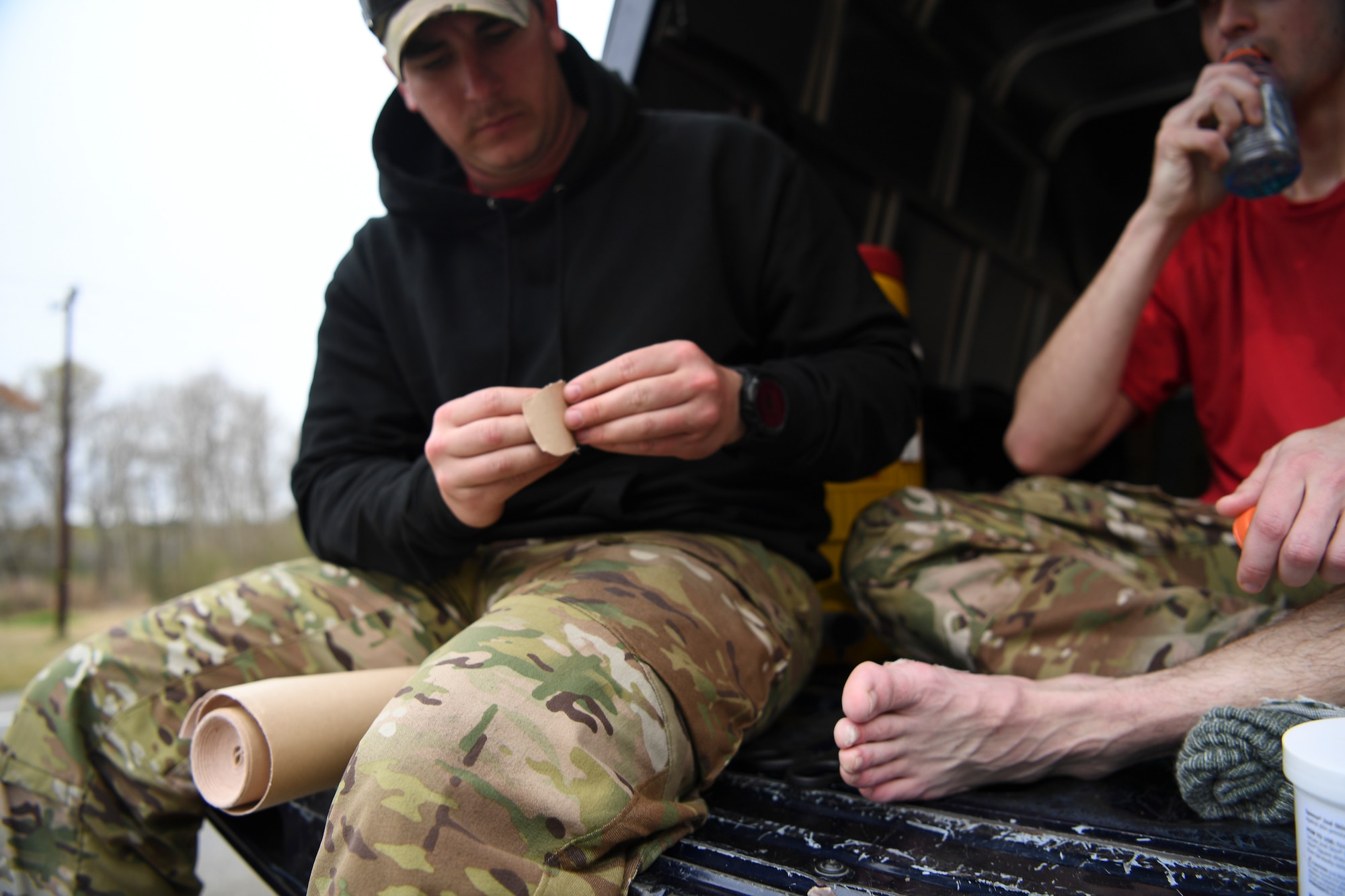 An independent duty medical technician with the 24th Special Operations Wing bandages a Special Tactics Airman’s foot during the Special Tactics Memorial March Feb 26, 2019, near Eunice, Louisiana.