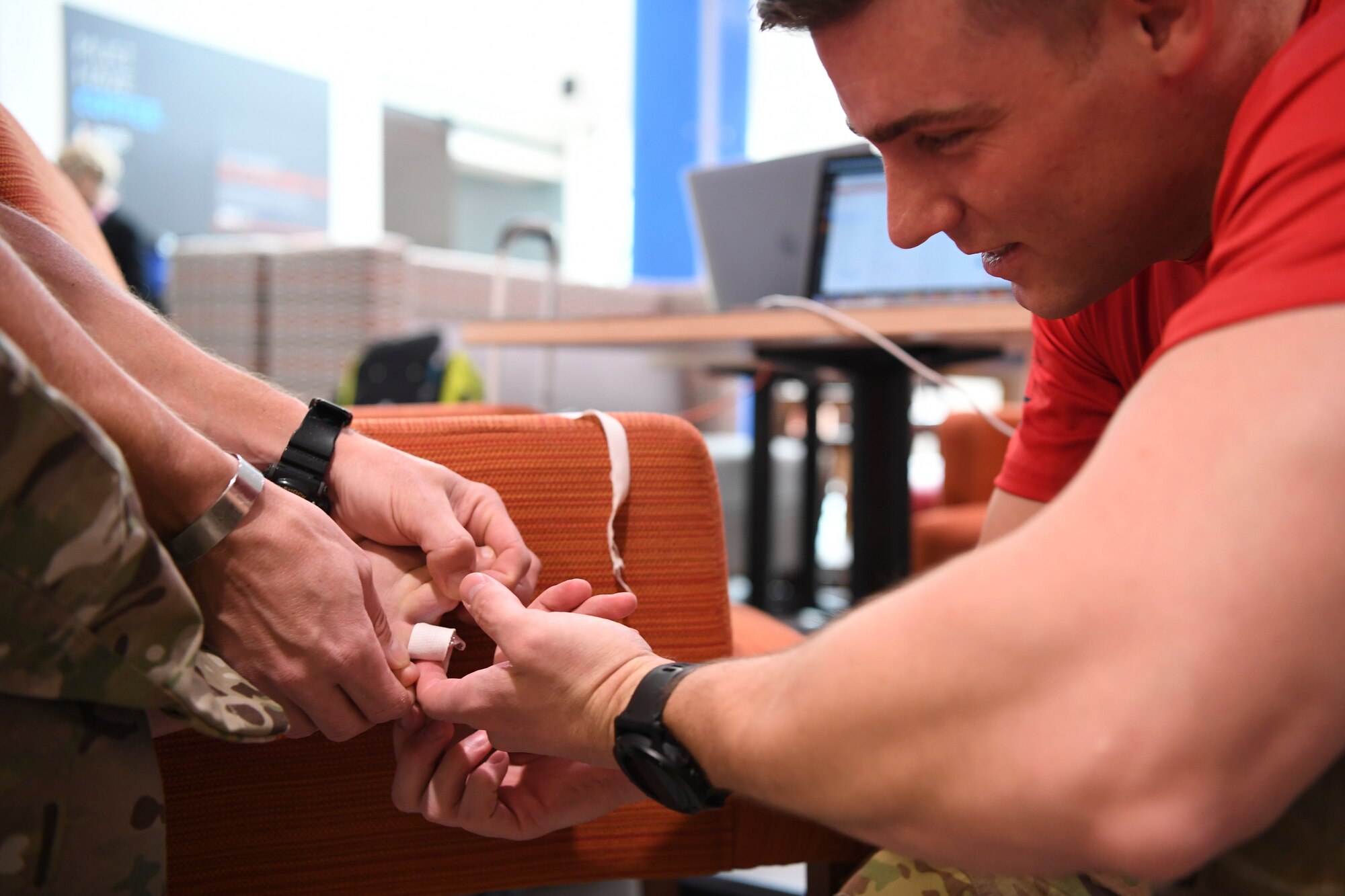 A Special Operations Surgical Team member with the 24th Special Operations Wing bandages a Special Tactics Airman’s foot during the Special Tactics Memorial March Feb 27, 2019, in Louisiana.