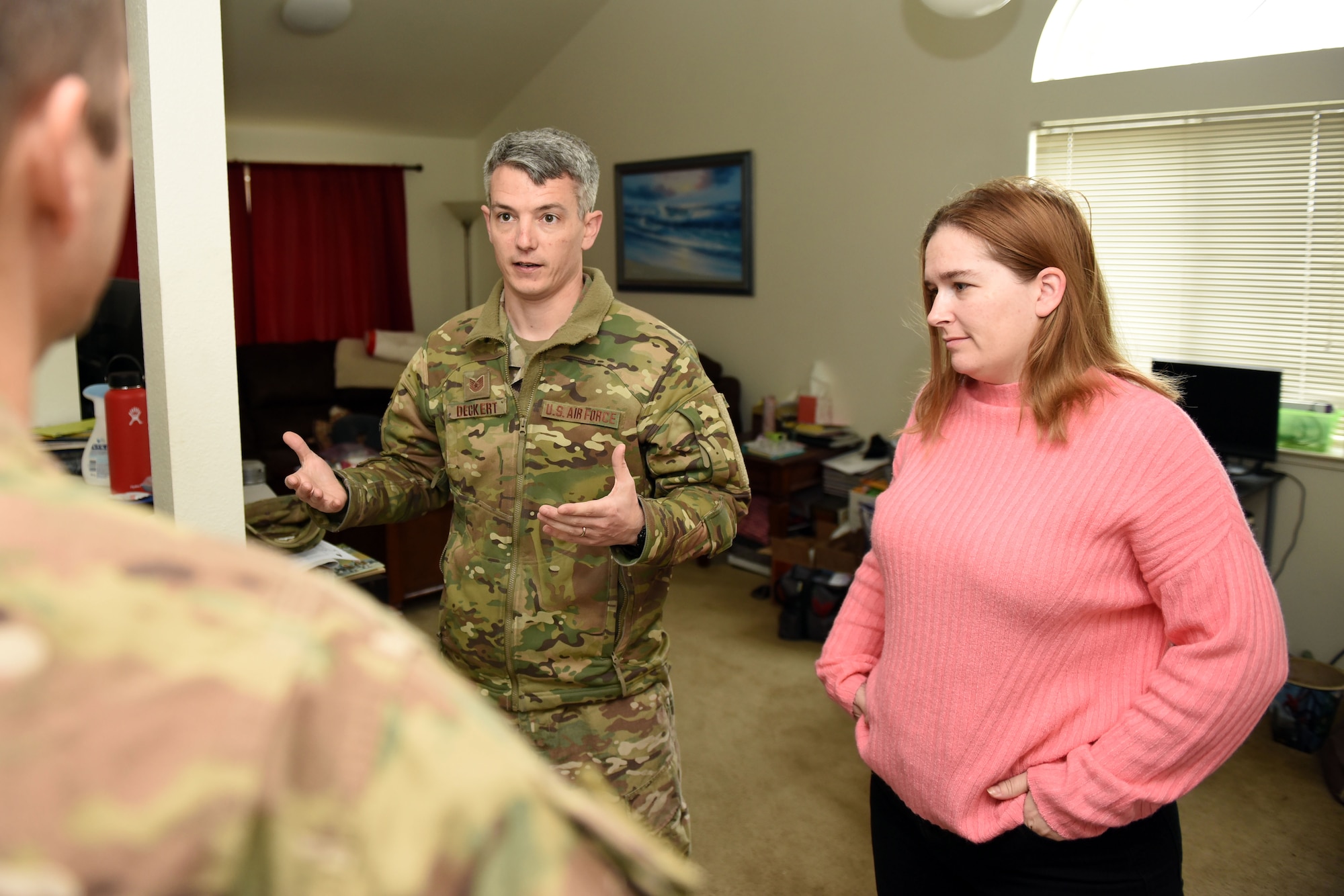U.S. Air Force Tech. Sgt. Thomas Decker, 60th Aerial Port Squadron NCO in charge of bunker operations, and his wife, Tracy, talk with U.S. Air Force Maj. Philip Lere, 60th APS operations officer, about issues facing their home during a review of their housing situation, Feb. 25 at Travis Air Force Base, California. The housing review comes as an Air Force-wide effort to take a proactive approach to resolveing any potential or chronic issues for facing housing residents. (U.S. Air Force photo by Airman 1st Class Christian Conrad)