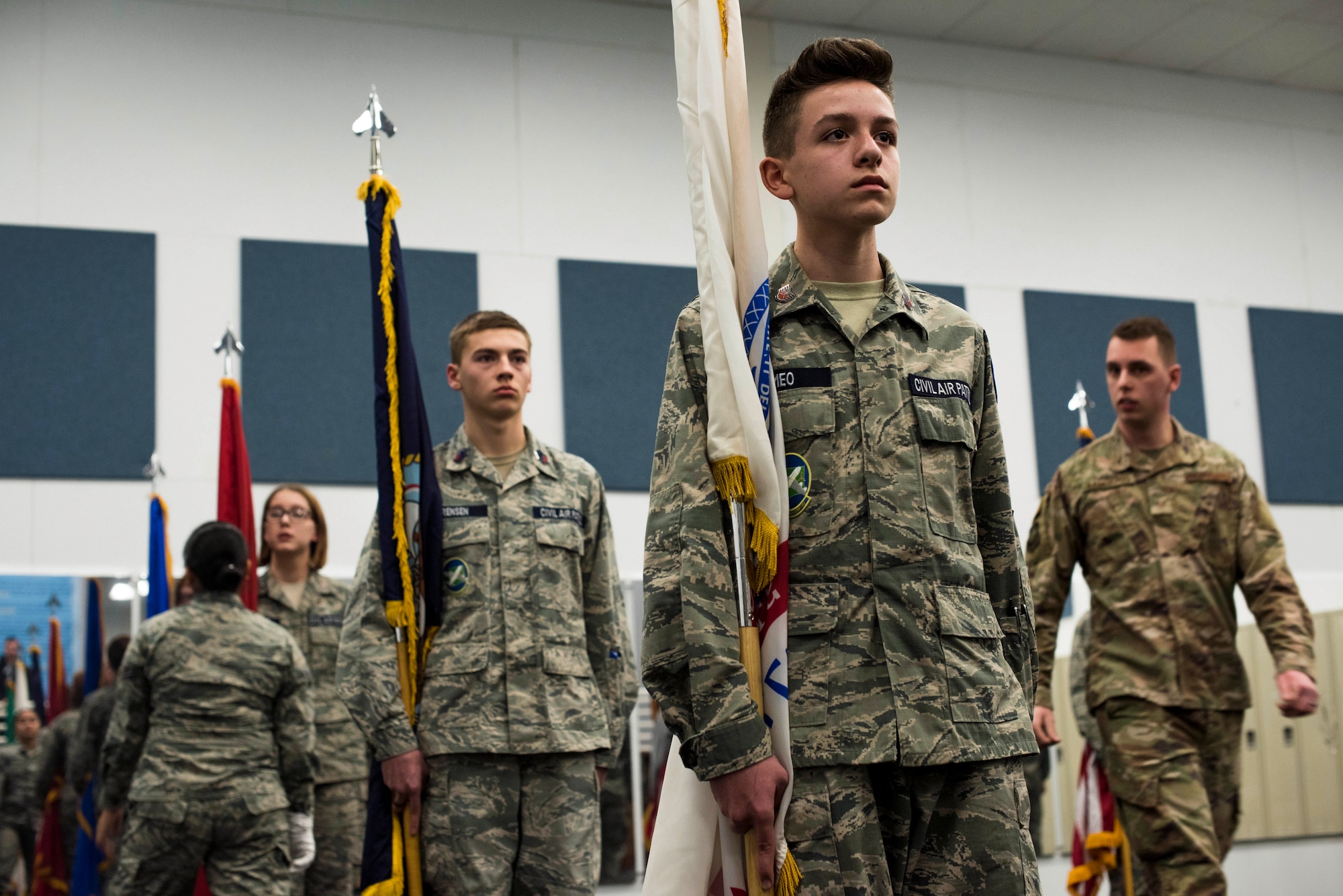 Cadets from the Civil Air Patrol 21st Fairchild Composite Squadron receive corrections and tips in performing color guard duty from 92nd Air Refueling Wing honor guardsmen at Fairchild Air Force Base, Washington, Feb. 26, 2019. Honor Guardsmen showcase their performances as a way to recruit, retain and inspire Airmen. (U.S. Air Force photo by Airman 1st Class Lawrence Sena)
