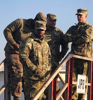 Sgt. Nolan Johnson with the 300th Sustainment Brigade surveys the fuel site during a site inspection in Erbil, Iraq, Feb.4, 2019.