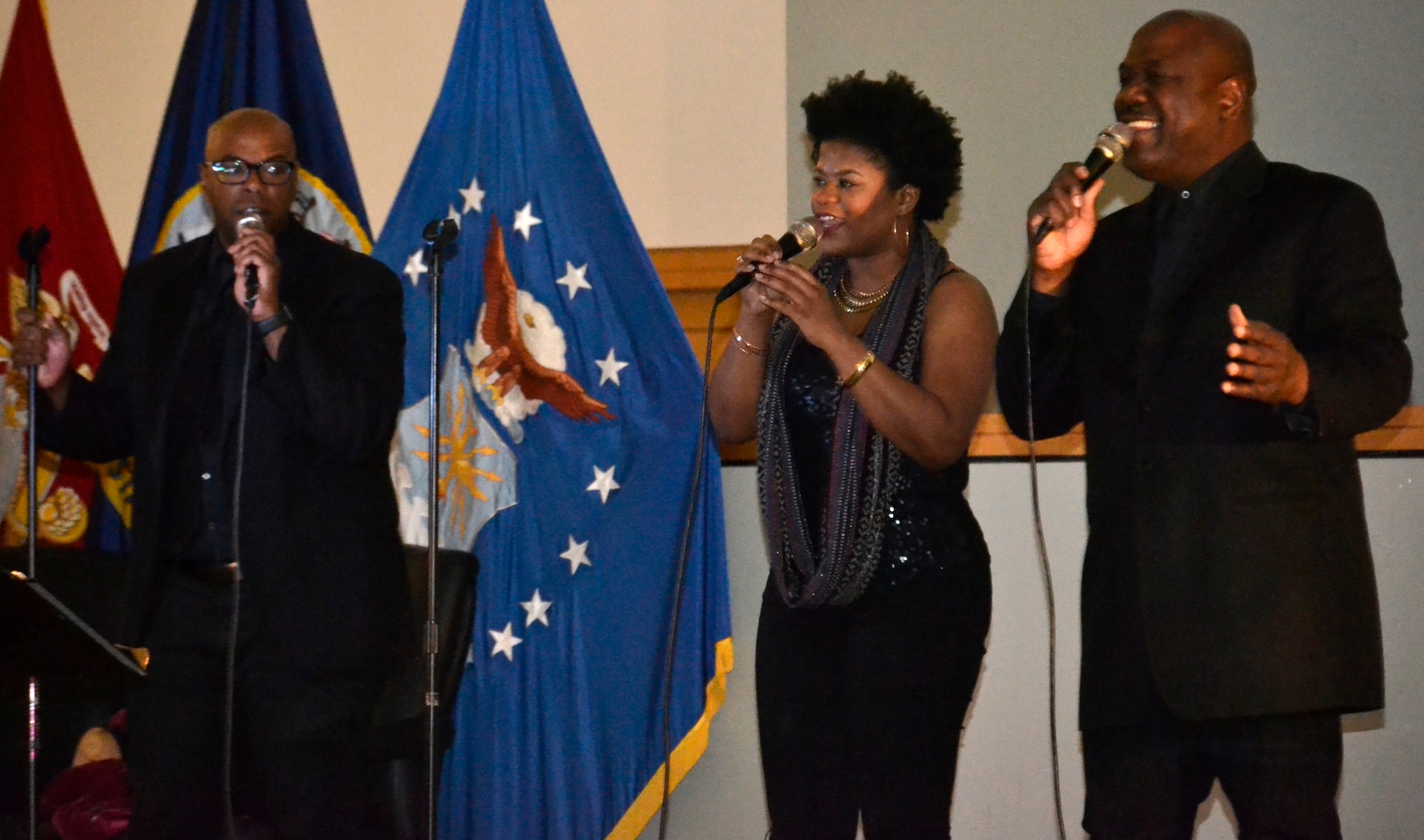 Key Arts performers Nathan Harmon, Shelia Moser and Joe Patterson, left to right, sing as employees clap along during DLA Troop Support’s celebration of African American History Month Feb. 27, 2019 in Philadelphia.