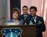 Mickey Hartinger, (left), spouse of Gen. (Ret.) James Hartinger, speaks to a celebration of Air Force Space Command’s 35th Anniversary at Peterson Air Force Base, Colorado, Sept. 18, 2017, as Senior Amn. Megan Richards (center), and Tech. Sgt. Beth Guidry (right) look on. (US Air Force photo/Dave Grim)