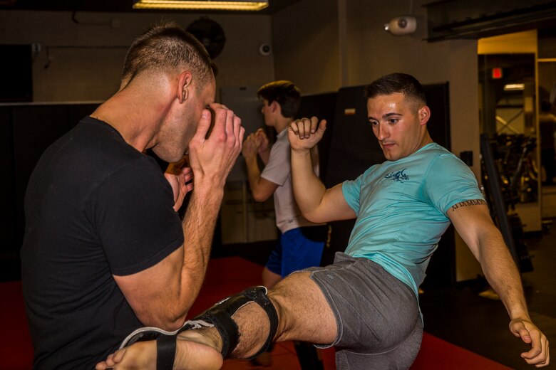 U.S. Marine Corps Sgt. Gianni Cappasso, an imagery analysis specialist assigned to Marine Fighter Attack Squadron 122, teaches Marines aboard Marine Corps Air Station (MCAS) Yuma Muy Thai techniques at the station gym on MCAS Yuma, Ariz., Feb. 13, 2019. Cappasso offers martial arts classes to Marines to provide them with the opportunity to use their spare time to become more deadly war-fighters and maintain a high level of physical fitness. (U.S. Marine Corps photo by Cpl. Isaac D. Martinez)