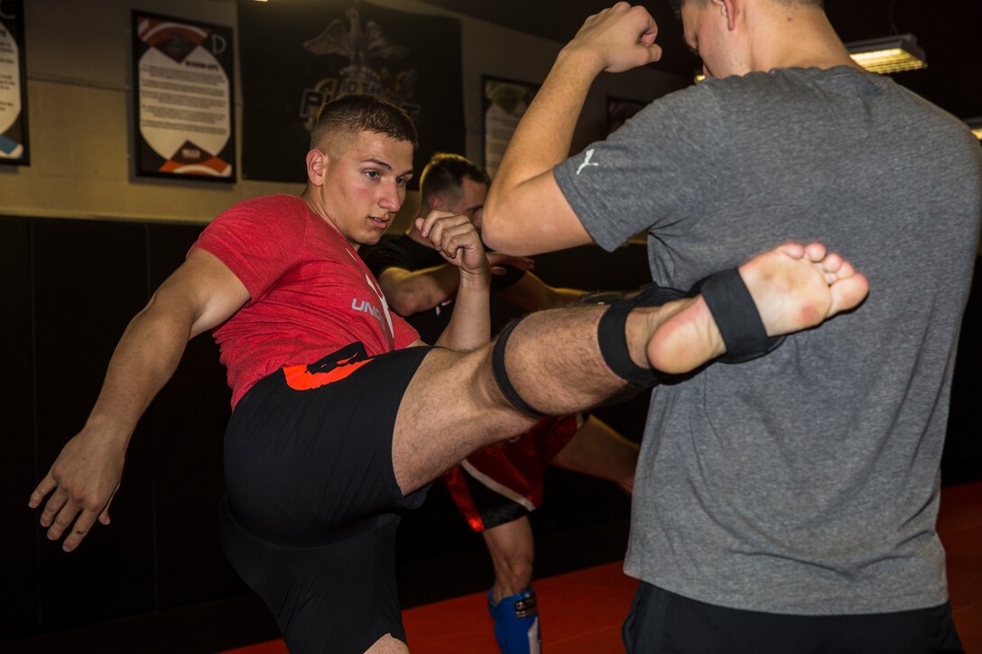 U.S. Marine Corps Sgt. Gianni Cappasso, an imagery analysis specialist assigned to Marine Fighter Attack Squadron 122, teaches Marines aboard Marine Corps Air Station (MCAS) Yuma Muy Thai techniques at the station gym on MCAS Yuma, Ariz., Feb. 13, 2019. Cappasso offers martial arts classes to Marines to provide them with the opportunity to use their spare time to become more deadly war-fighters and maintain a high level of physical fitness. (U.S. Marine Corps photo by Cpl. Isaac D. Martinez)