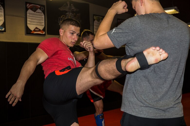 U.S. Marine Corps Sgt. Gianni Cappasso, an imagery analysis specialist assigned to Marine Fighter Attack Squadron 122, teaches Marines aboard Marine Corps Air Station (MCAS) Yuma Muy Thai techniques at the station gym on MCAS Yuma, Ariz., Feb. 13, 2019. Cappasso offers martial arts classes to Marines to provide them with the opportunity to use their spare time to become more deadly war-fighters and maintain a high level of physical fitness. (U.S. Marine Corps photo by Cpl. Isaac D. Martinez)
