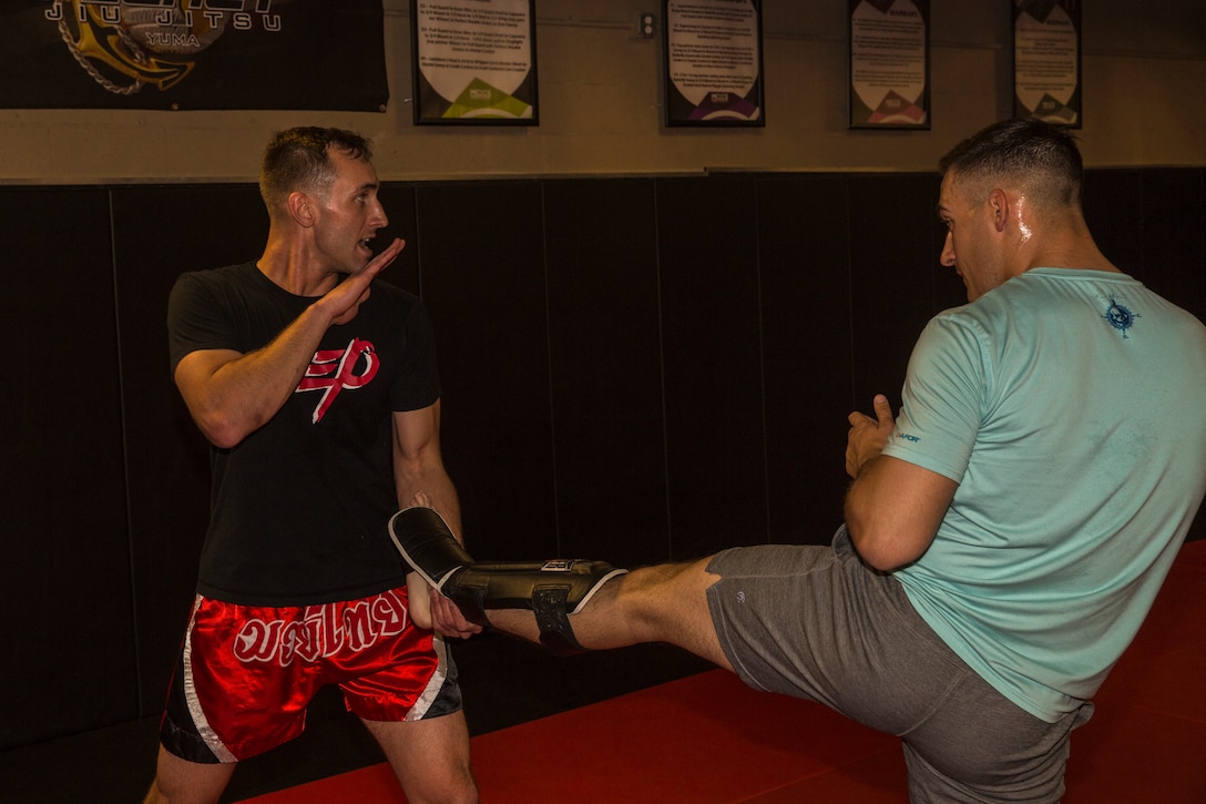 U.S. Marine Corps Sgt. Gianni Cappasso, an imagery analysis specialist assigned to Marine Fighter Attack Squadron 122, teaches Marines aboard Marine Corps Air Station (MCAS) Yuma Muy Thai techniques at the station gym on MCAS Yuma, Ariz., Feb. 13, 2019. Cappasso offers martial arts classes to Marines to provide them with the opportunity to use their spare time to become more deadly war-fighters and maintain a high level of physical fitness. (U.S. Marine Corps photo by Cpl. Isaac D. Martinez)