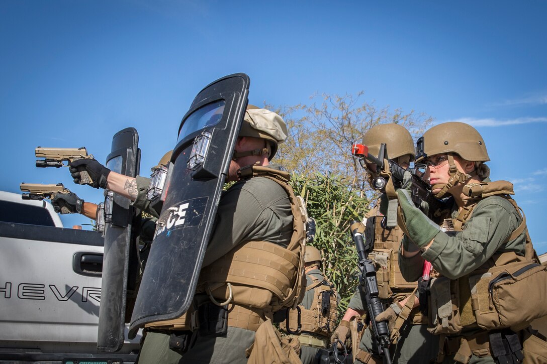 U.S. Marines with the Provost Marshal's Office (PMO), Headquarters and Headquarters Squadron (H&HS), Marine Corps Air Station (MCAS) Yuma, conduct Special Reaction Team (SRT) training on MCAS Yuma, Ariz., Feb. 25, 2019. The SRT is comprised of military police personnel trained to give an installation commander the ability to counter or contain a special threat situation surpassing normal law enforcement capabilities. (U.S. Marine Corps photo by Sgt. Allison Lotz)