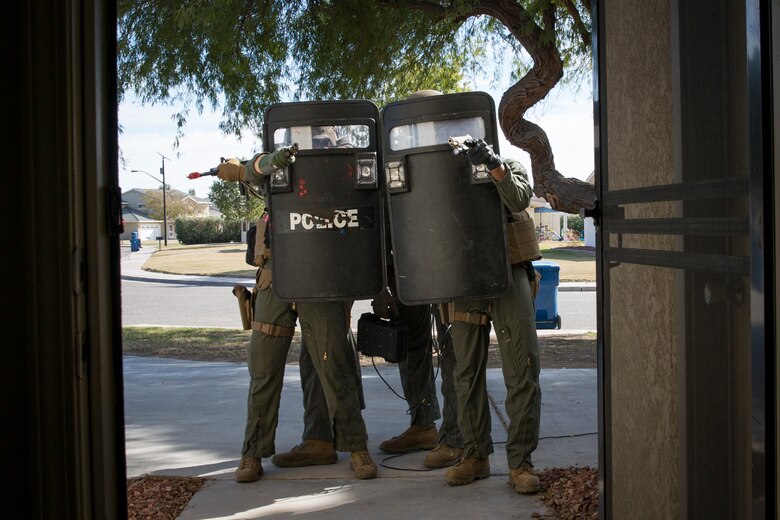 U.S. Marines with the Provost Marshal's Office (PMO), Headquarters and Headquarters Squadron (H&HS), Marine Corps Air Station (MCAS) Yuma, conduct Special Reaction Team (SRT) training on MCAS Yuma, Ariz., Feb. 25, 2019. The SRT is comprised of military police personnel trained to give an installation commander the ability to counter or contain a special threat situation surpassing normal law enforcement capabilities. (U.S. Marine Corps photo by Sgt. Allison Lotz)