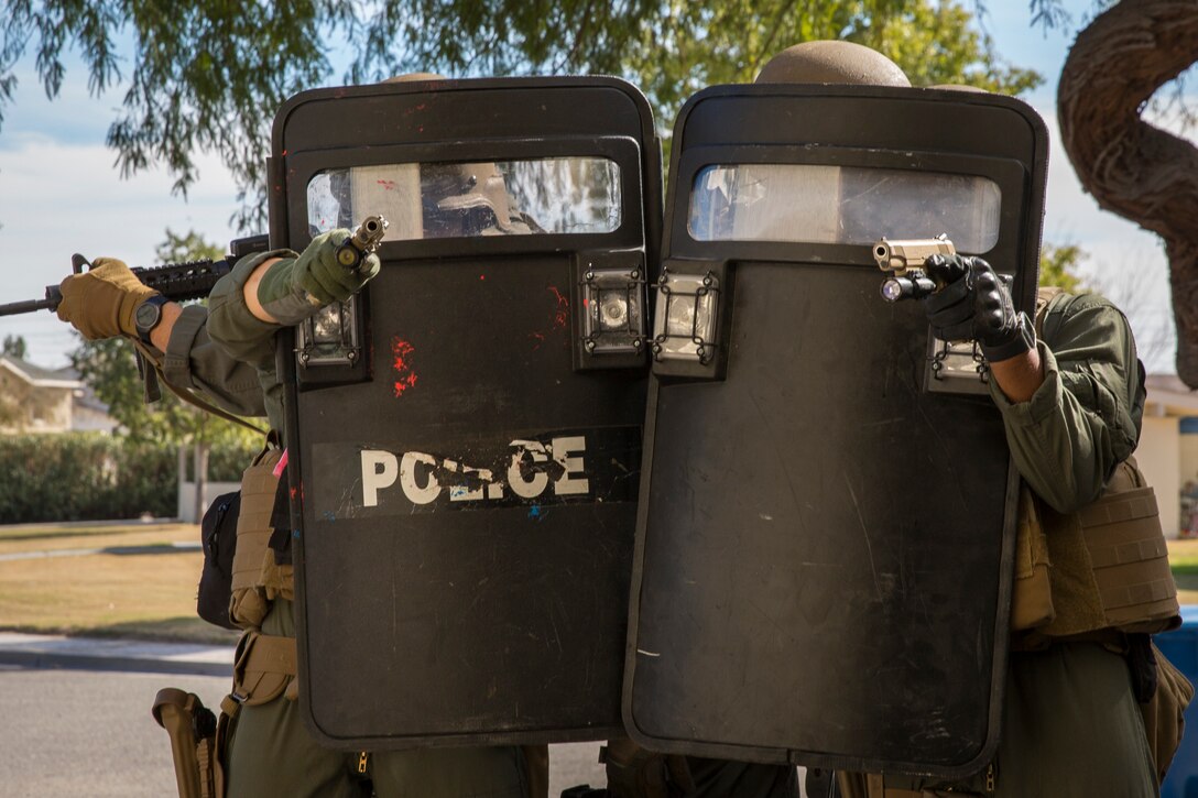 U.S. Marines with the Provost Marshal's Office (PMO), Headquarters and Headquarters Squadron (H&HS), Marine Corps Air Station (MCAS) Yuma, conduct Special Reaction Team (SRT) training on MCAS Yuma, Ariz., Feb. 25, 2019. The SRT is comprised of military police personnel trained to give an installation commander the ability to counter or contain a special threat situation surpassing normal law enforcement capabilities. (U.S. Marine Corps photo by Sgt. Allison Lotz)