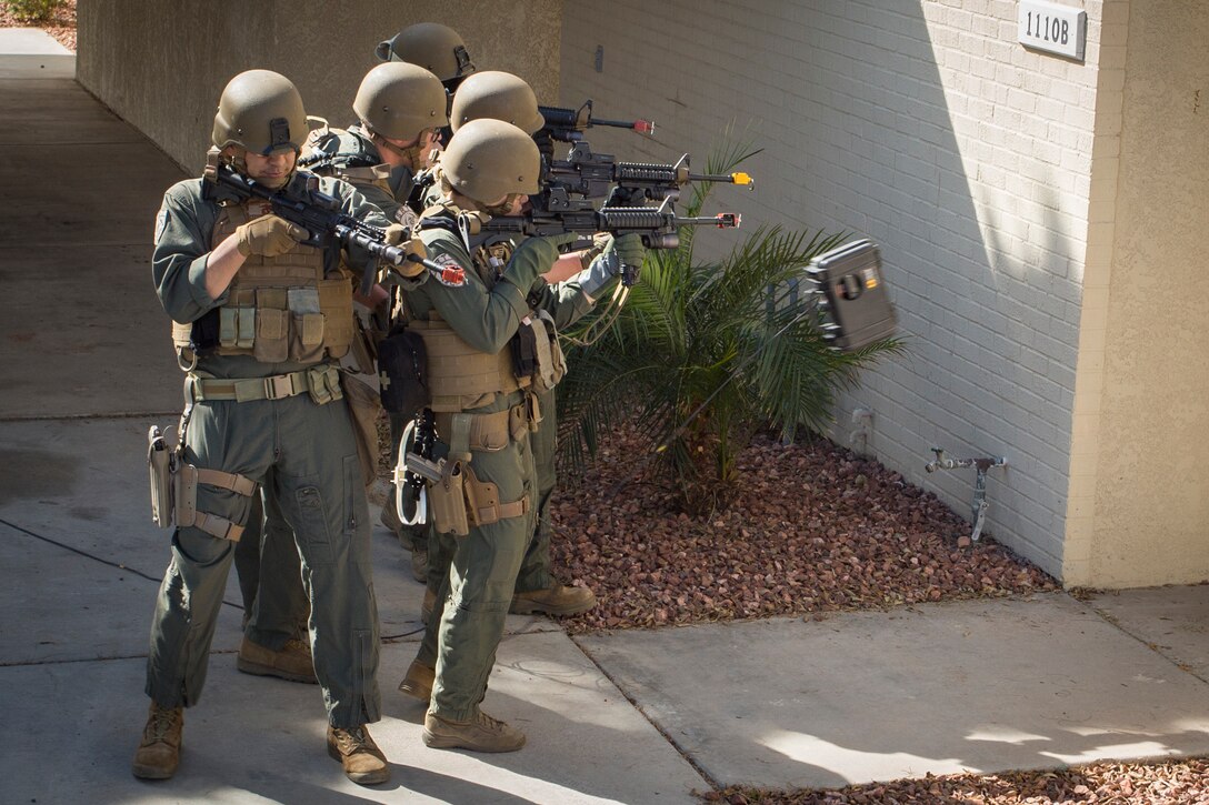 U.S. Marines with the Provost Marshal's Office (PMO), Headquarters and Headquarters Squadron (H&HS), Marine Corps Air Station (MCAS) Yuma, conduct Special Reaction Team (SRT) training on MCAS Yuma, Ariz., Feb. 25, 2019. The SRT is comprised of military police personnel trained to give an installation commander the ability to counter or contain a special threat situation surpassing normal law enforcement capabilities. (U.S. Marine Corps photo by Sgt. Allison Lotz)