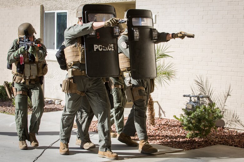 U.S. Marines with the Provost Marshal's Office (PMO), Headquarters and Headquarters Squadron (H&HS), Marine Corps Air Station (MCAS) Yuma, conduct Special Reaction Team (SRT) training on MCAS Yuma, Ariz., Feb. 25, 2019. The SRT is comprised of military police personnel trained to give an installation commander the ability to counter or contain a special threat situation surpassing normal law enforcement capabilities. (U.S. Marine Corps photo by Sgt. Allison Lotz)