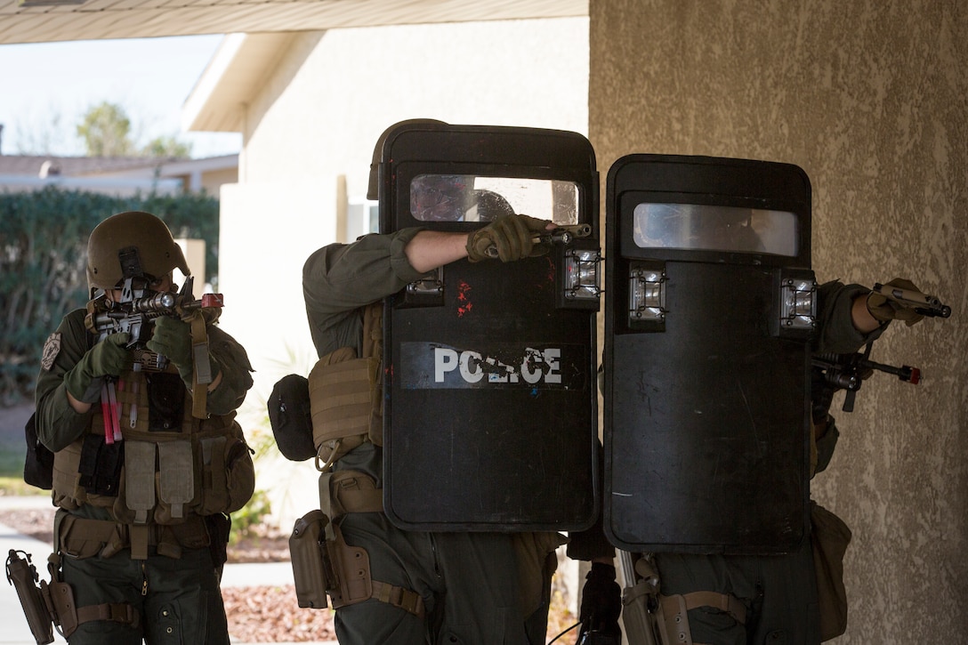 U.S. Marines with the Provost Marshal's Office (PMO), Headquarters and Headquarters Squadron (H&HS), Marine Corps Air Station (MCAS) Yuma, conduct Special Reaction Team (SRT) training on MCAS Yuma, Ariz., Feb. 25, 2019. The SRT is comprised of military police personnel trained to give an installation commander the ability to counter or contain a special threat situation surpassing normal law enforcement capabilities. (U.S. Marine Corps photo by Sgt. Allison Lotz)