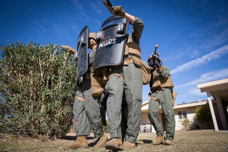 U.S. Marines with the Provost Marshal's Office (PMO), Headquarters and Headquarters Squadron (H&HS), Marine Corps Air Station (MCAS) Yuma, conduct Special Reaction Team (SRT) training on MCAS Yuma, Ariz., Feb. 25, 2019. The SRT is comprised of military police personnel trained to give an installation commander the ability to counter or contain a special threat situation surpassing normal law enforcement capabilities. (U.S. Marine Corps photo by Sgt. Allison Lotz)