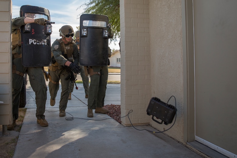 U.S. Marines with the Provost Marshal's Office (PMO), Headquarters and Headquarters Squadron (H&HS), Marine Corps Air Station (MCAS) Yuma, conduct Special Reaction Team (SRT) training on MCAS Yuma, Ariz., Feb. 25, 2019. The SRT is comprised of military police personnel trained to give an installation commander the ability to counter or contain a special threat situation surpassing normal law enforcement capabilities. (U.S. Marine Corps photo by Sgt. Allison Lotz)