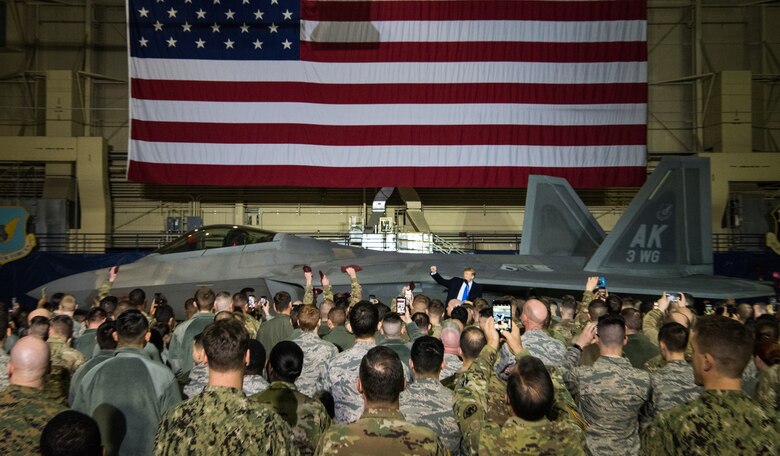 More than 100 Airmen, Sailors, Soldiers, Marines, and Coast Guardsmen welcome President Donald Trump at Joint Base Elmendorf-Richardson, Alaska, Feb. 28, 2019. The president was at the base to meet with service members after returning from a summit in Hanoi, Vietnam.