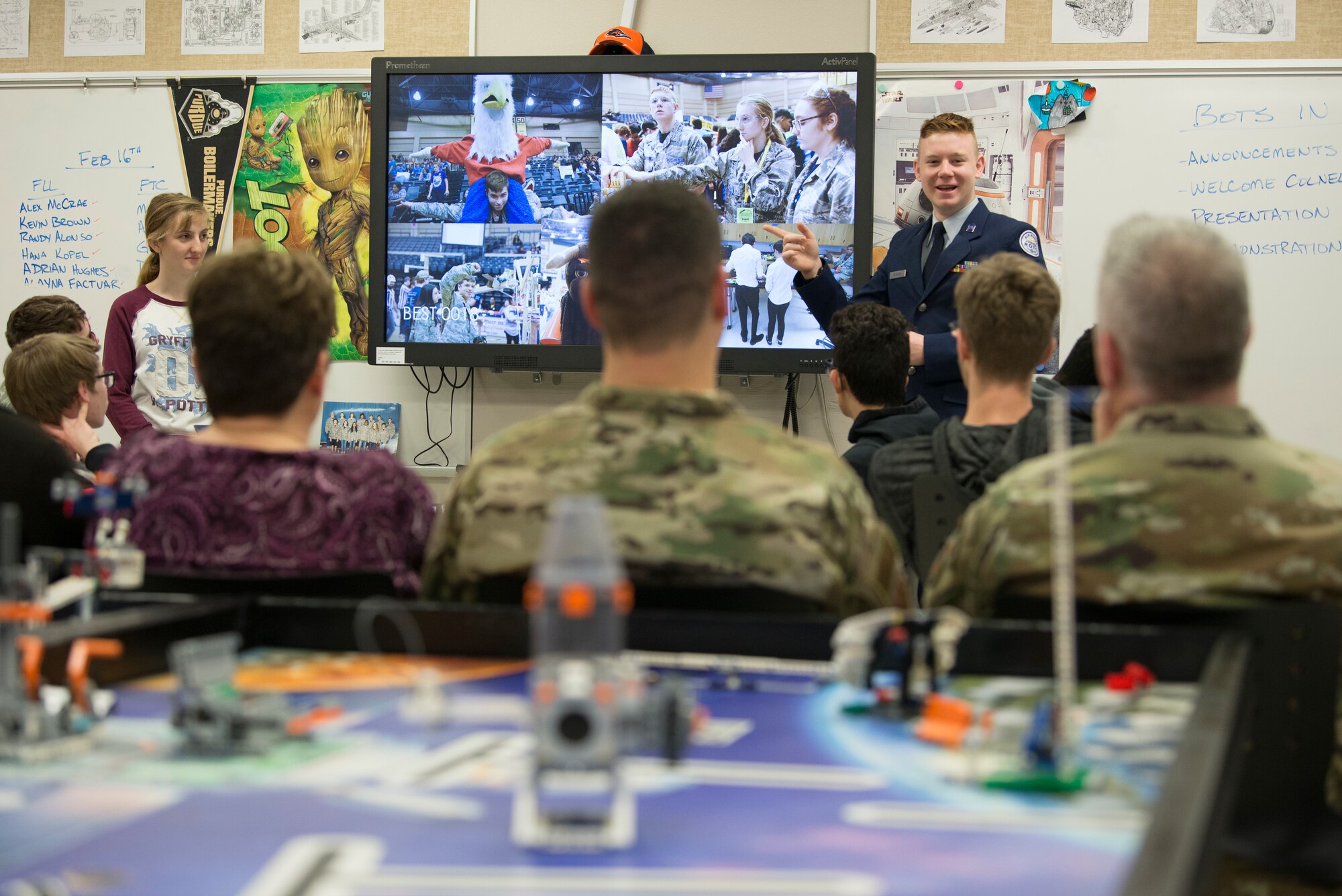 Jordan Peterson, son of Maj. Frederick Peterson, Air Force Installation and Mission Support Center installation engineer program manager, explains the Bots in Blues’s activities and success at competitions to two colonels visiting Virginia Allred Stacey Junior/Senior High School Feb. 13, 2019, at Joint Base San Antonio-Lackland, Texas.