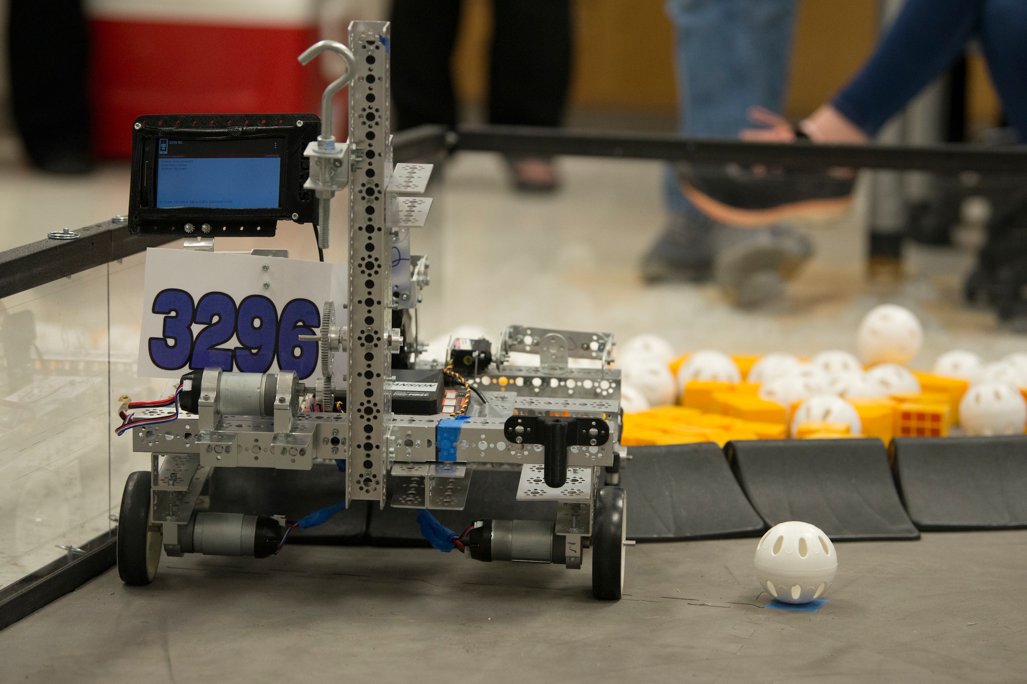 The Bots in Blues, a FIRST Tech Challenge team, showcase their award winning robot to Col. Robert W. Trayers Jr., Air Force Recruiting Service vice commander, and Lt. Col. Steven Lamb, 502nd Installation Support Group vice commander, during a visit to Virginia Allred Stacey Junior/Senior High School Feb. 13, 2019, at Joint Base San Antonio-Lackland, Texas.