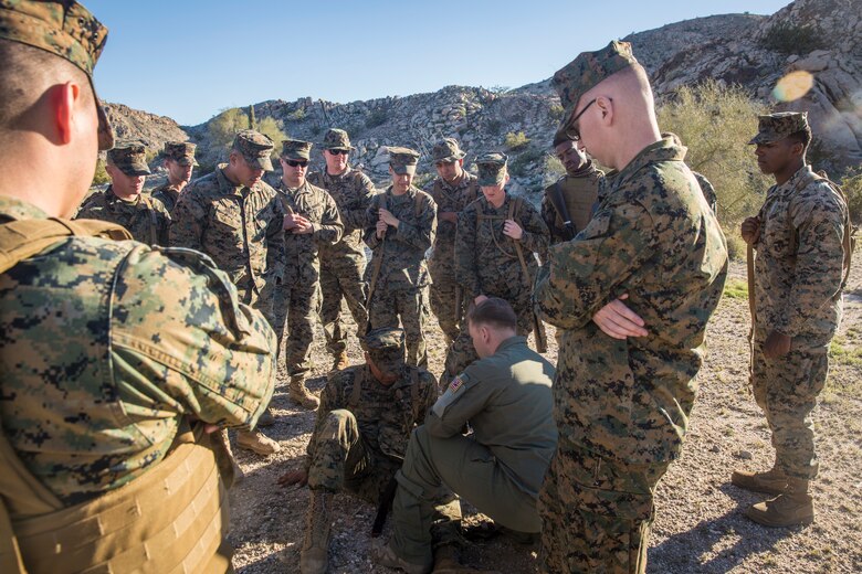 U.S. Marines and Sailors stationed on Marine Corps Air Station (MCAS) Yuma participate in "Operation Backbone" in Yuma, Ariz., Feb. 7, 2019. Operation Backbone is a quarterly unit exercise meant to strengthen the warrior's spirit in the non-commisioned officers (NCOs) and promote cohesion between them. The exercise consisted of a hike with the Headquarters and Headquarters Squadron (H&HS)  commanding officer and acting sergeant major, several classes, and a warriors night. Classes included simulated room clearing training, terrain model training, improvised explosive devices (IED) training, and the Family Advocacy Program on station sent out a representative to talk to the NCOs about leadership. (U.S. Marine Corps photo by Cpl. Isaac D. Martinez)