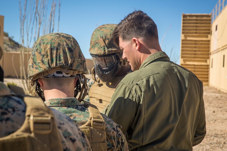 U.S. Marines and Sailors stationed on Marine Corps Air Station (MCAS) Yuma participate in "Operation Backbone" in Yuma, Ariz., Feb. 7, 2019. Operation Backbone is a quarterly unit exercise meant to strengthen the warrior's spirit in the non-commisioned officers (NCOs) and promote cohesion between them. The exercise consisted of a hike with the Headquarters and Headquarters Squadron (H&HS)  commanding officer and acting sergeant major, several classes, and a warriors night. Classes included simulated room clearing training, terrain model training, improvised explosive devices (IED) training, and the Family Advocacy Program on station sent out a representative to talk to the NCOs about leadership. (U.S. Marine Corps photo by Cpl. Isaac D. Martinez)