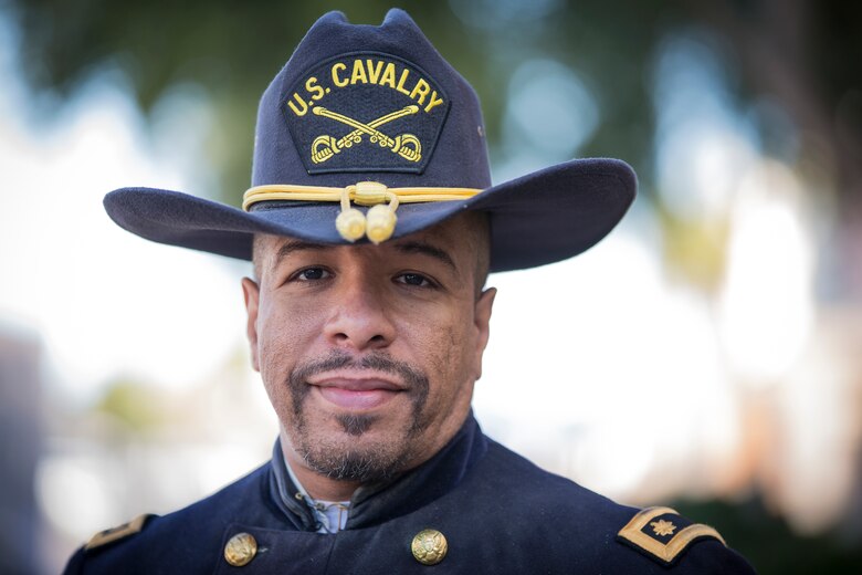 A Civilian with the Buffalo Soldiers of the Arizona Territory and Ladies and Gentlemen of the Regiment pose for a portrait photo during Yuma Military Appreciation Day in Downtown Historic Yuma on Feb. 16, 2019. Military Appreciation Day is held to show the importance of the relationship between the City of Yuma and our service members and veterans. (U.S. Marine Corps photo by Sgt. Allison Lotz)