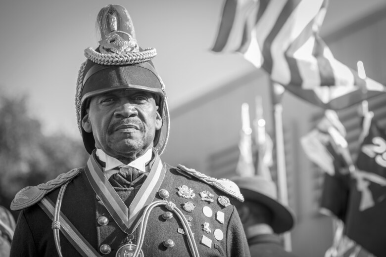 A Civilian with the Buffalo Soldiers of the Arizona Territory and Ladies and Gentlemen of the Regiment pose for a portrait photo during Yuma Military Appreciation Day in Downtown Historic Yuma on Feb. 16, 2019. Military Appreciation Day is held to show the importance of the relationship between the City of Yuma and our service members and veterans. (U.S. Marine Corps photo by Sgt. Allison Lotz)