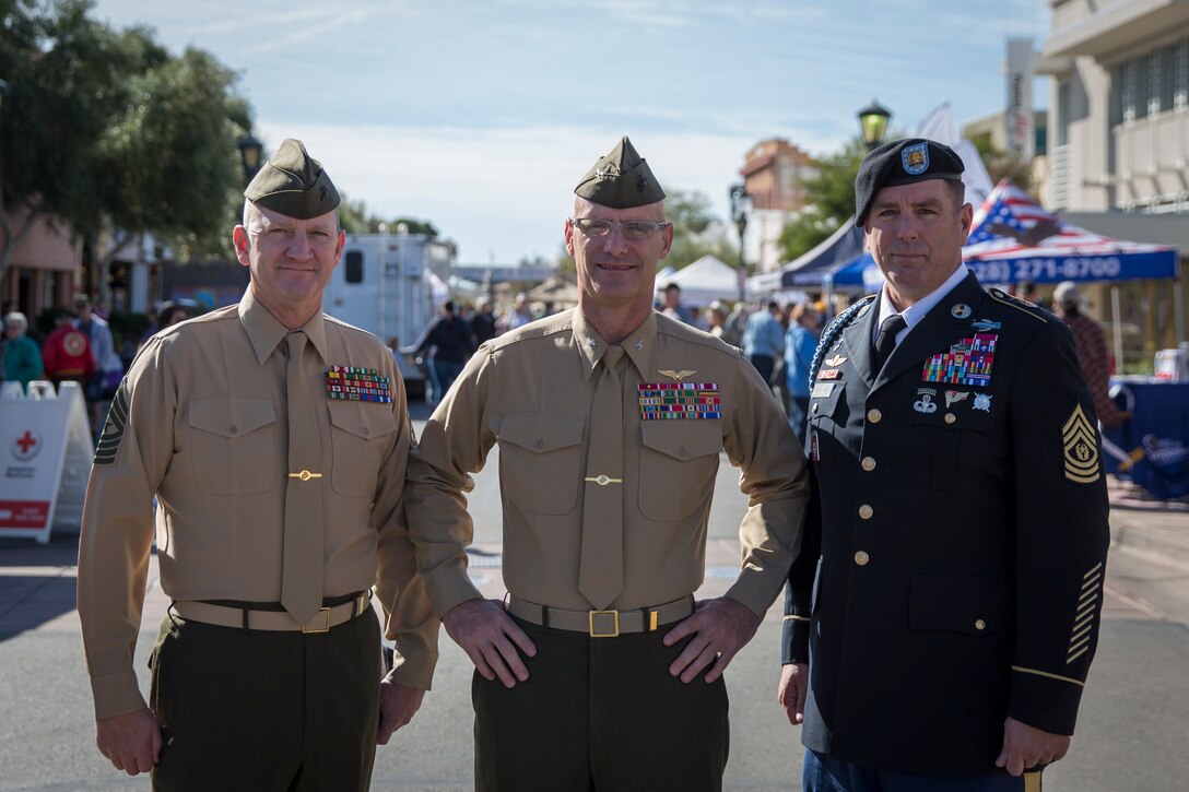 U.S. Marine Corps Col. David A. Suggs (center), commanding officer, Marine Corps Air Station (MCAS) Yuma, Sgt. Maj. David M. Leikwold (left), sergeant major, MCAS Yuma, and U.S. Soldier Sgt. Maj. Jamathon K. Nelson, sergeant major, Yuma Proving Ground pose for a group photo during Yuma Military Appreciation Day in Downtown Historic Yuma on Feb. 16, 2019. Military Appreciation Day is held to show the importance of the relationship between the City of Yuma and our service members and veterans. (U.S. Marine Corps photo by Sgt. Allison Lotz)