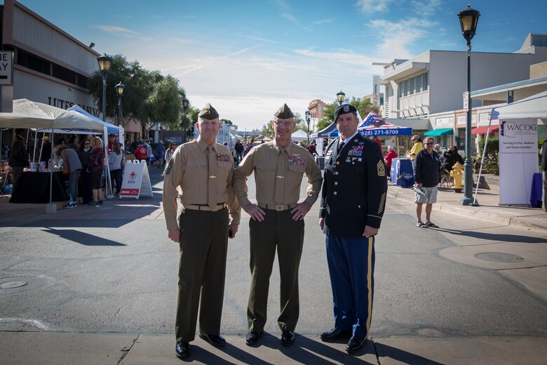 U.S. Marine Corps Col. David A. Suggs (center), commanding officer, Marine Corps Air Station (MCAS) Yuma, Sgt. Maj. David M. Leikwold (left), sergeant major, MCAS Yuma, and U.S. Soldier Sgt. Maj. Jamathon K. Nelson, sergeant major, Yuma Proving Ground pose for a group photo during Yuma Military Appreciation Day in Downtown Historic Yuma on Feb. 16, 2019. Military Appreciation Day is held to show the importance of the relationship between the City of Yuma and our service members and veterans. (U.S. Marine Corps photo by Sgt. Allison Lotz)