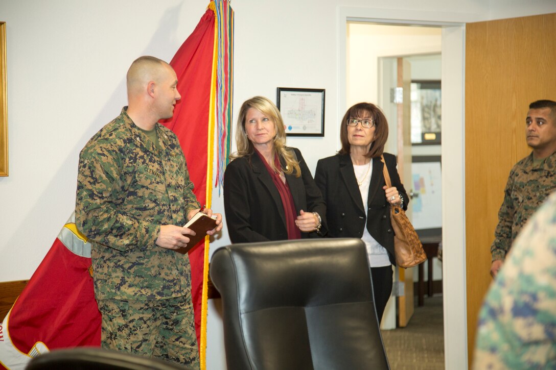 Colonel Craig C. Clemans, commanding officer, Marine Corps Logistics Base Barstow, California, introduces Dawn Rowe, San Bernardino County Third District Supervisor, to his staff at the weekly Command Group Meeting, Feb. 19. Rowe was joined by her field representative Elaine Villareal, on her "getting to know you" visit to the base.