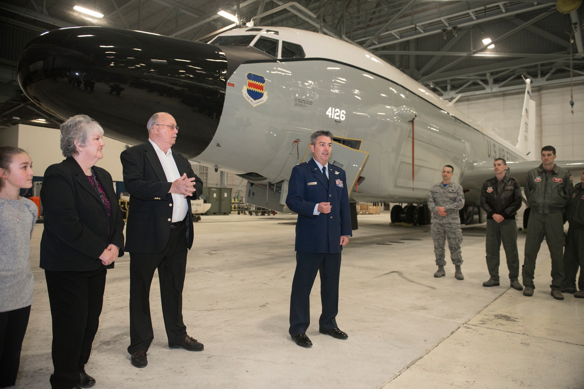 Lt. Col. Harley Barmore introduces his parents, Dennis and Ruth Barmore, during an informal ceremony in front of an RC-135 Rivet Joint inside the Bennie L. Davis Maintenance Facility February 15, 2019 at Offutt Air Force Base, Nebraska. Barmore’s parents, who were former Air Force maintainers, pinned Lt. Col. Barmore’s maintenance badge on his uniform as he was recently appointed as the 55th Maintenance Group deputy commander. (U.S. Air Force photo by Delanie Stafford)
