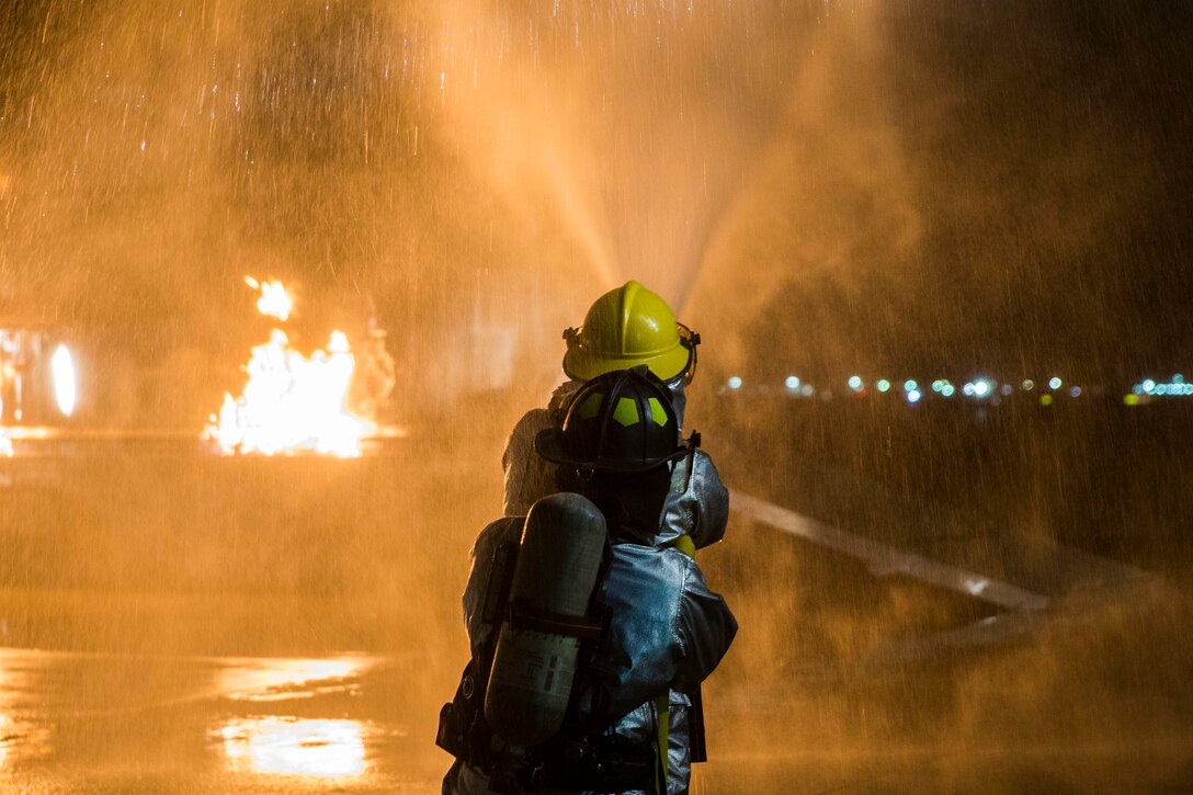 U.S. Marines with Aircraft Rescue and Fire Fighting (ARFF) conduct Hand Line Drills at Marine Corps Air Station (MCAS) Yuma Feb. 15, 2019. These drills focus on techniques to push fuel fires away from aircraft and simulate large aircraft fire fighting. The Marines train monthly to enhance their readiness when responding to hazards or emergencies on the flight line. (U.S. Marine Corps photo by Cpl. Sabrina Candiaflores)