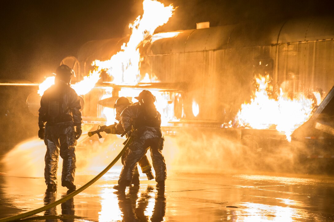 U.S. Marines with Aircraft Rescue and Fire Fighting (ARFF) conduct Hand Line Drills at Marine Corps Air Station (MCAS) Yuma Feb. 15, 2019. These drills focus on techniques to push fuel fires away from aircraft and simulate large aircraft fire fighting. The Marines train monthly to enhance their readiness when responding to hazards or emergencies on the flight line. (U.S. Marine Corps photo by Cpl. Sabrina Candiaflores)